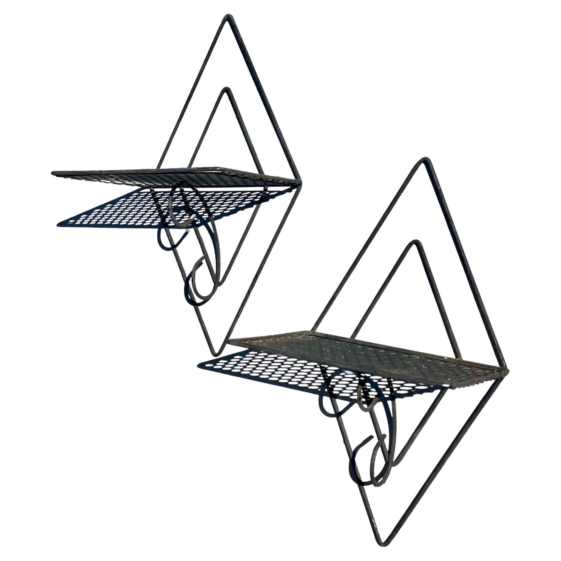 versatile pair of decorative metal wall shelves circa 1950's , nice rare pieces easy to hang great for that Mid century ,atomic age decor.