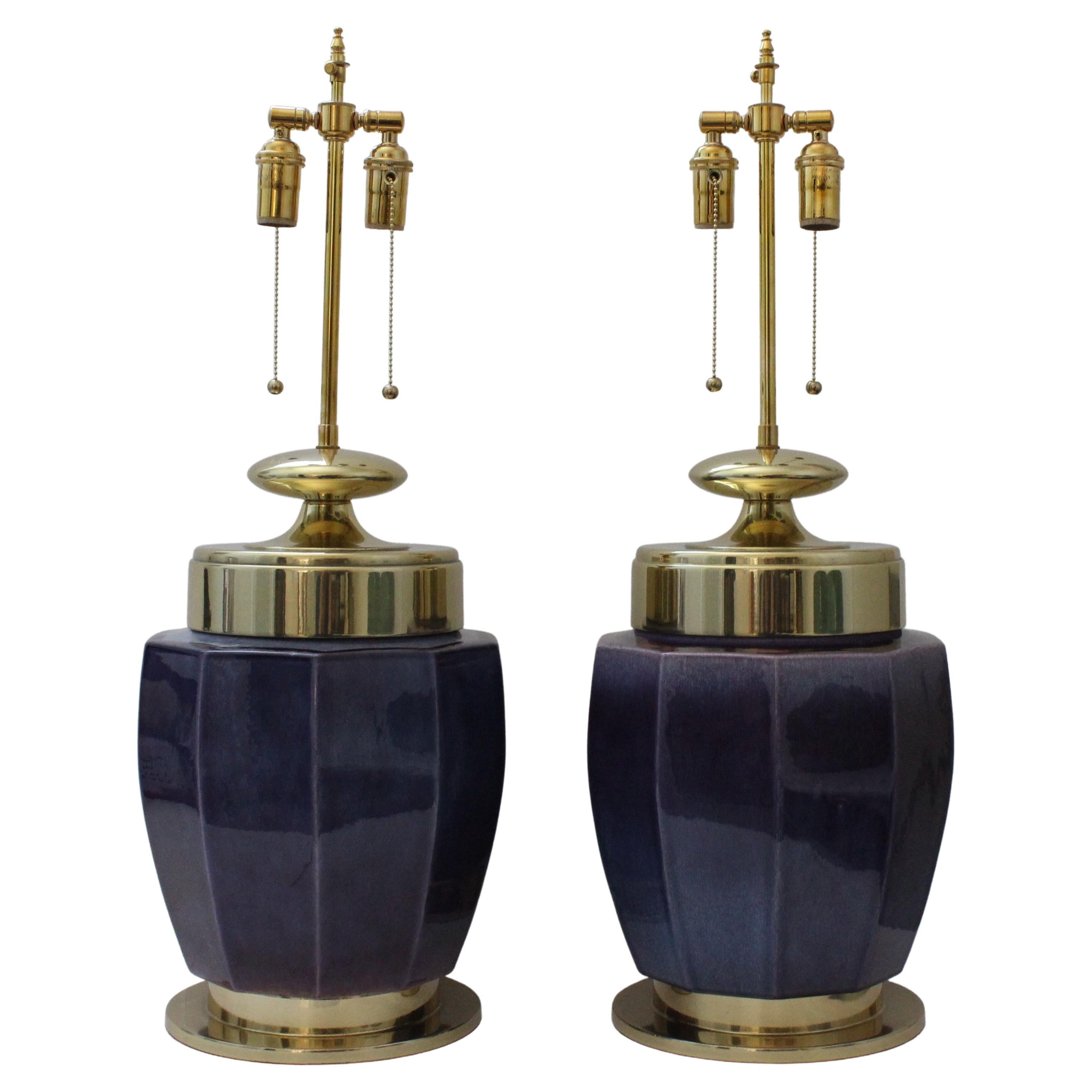This stylish and dramatic set of Stiffel table lamps date to the 1960s and the were acquired from a Palm Beach estate. The translucent aubergine glaze compliments the polished brass hardware. 

Note: Before we acquired them they had been