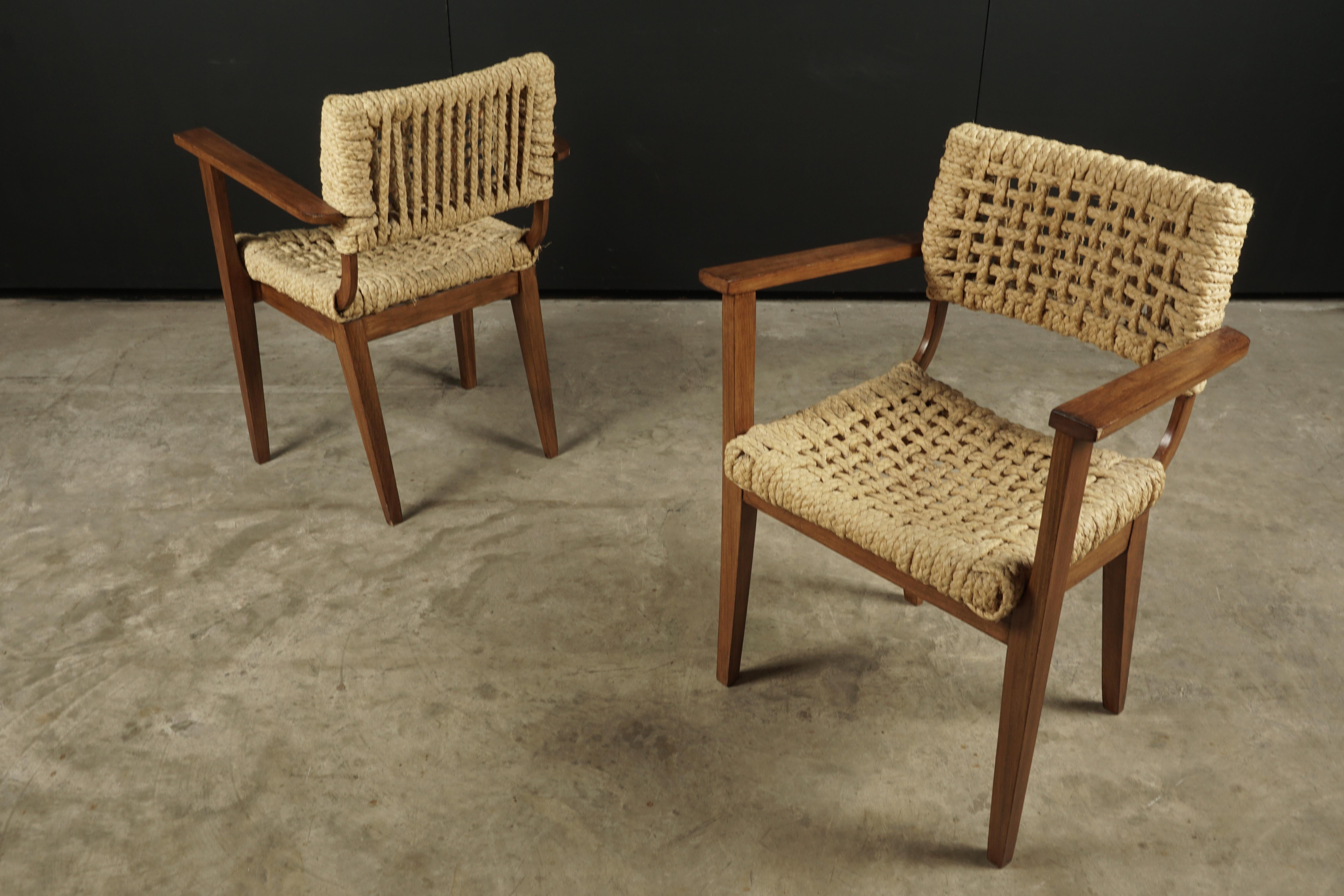 Vintage Pair of Audoux Minet armchairs from France, circa 1940. Oak frames with rope seats and backs.