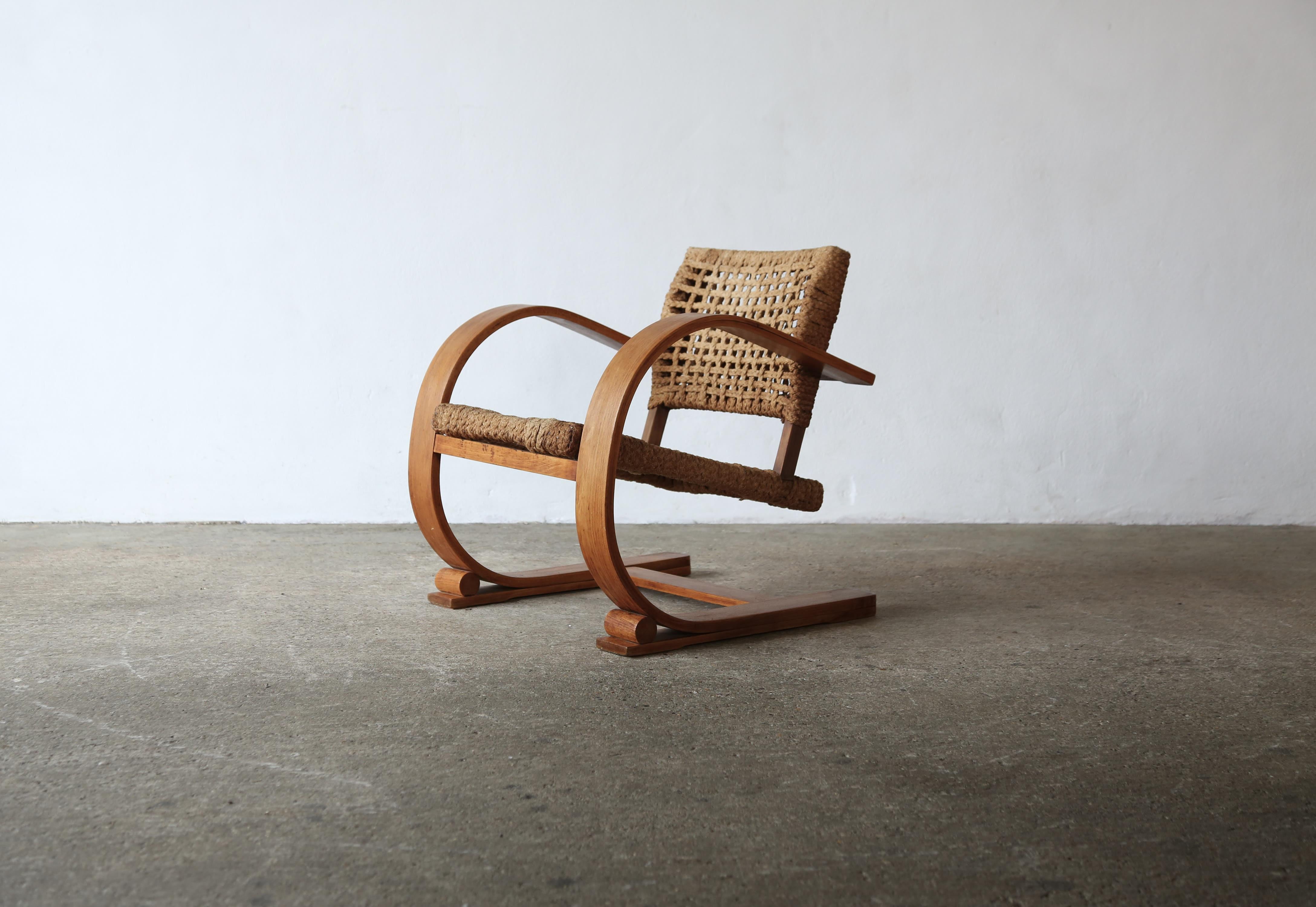 A superb rope and wood cantilever chairs by Frida Minet and Adrien Audoux, 1950s, France.  In original condition, with some wear, marks and signs of age and use to the wood rope.  Fast shipping worldwide.



