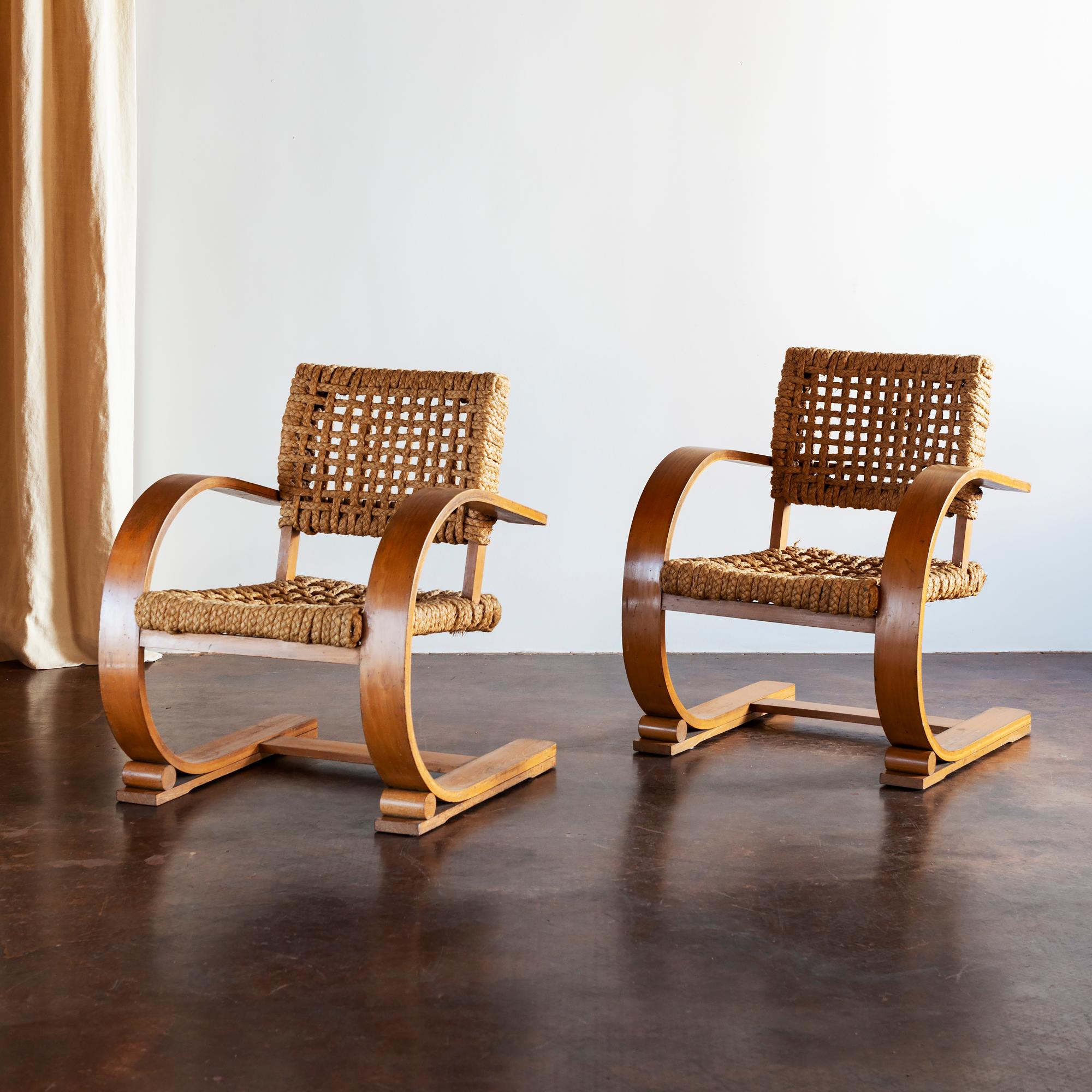 Pair of elegant easy chairs in bent beech and original braided rope by Adrien Audoux and Frida Minet. France, 1940s.