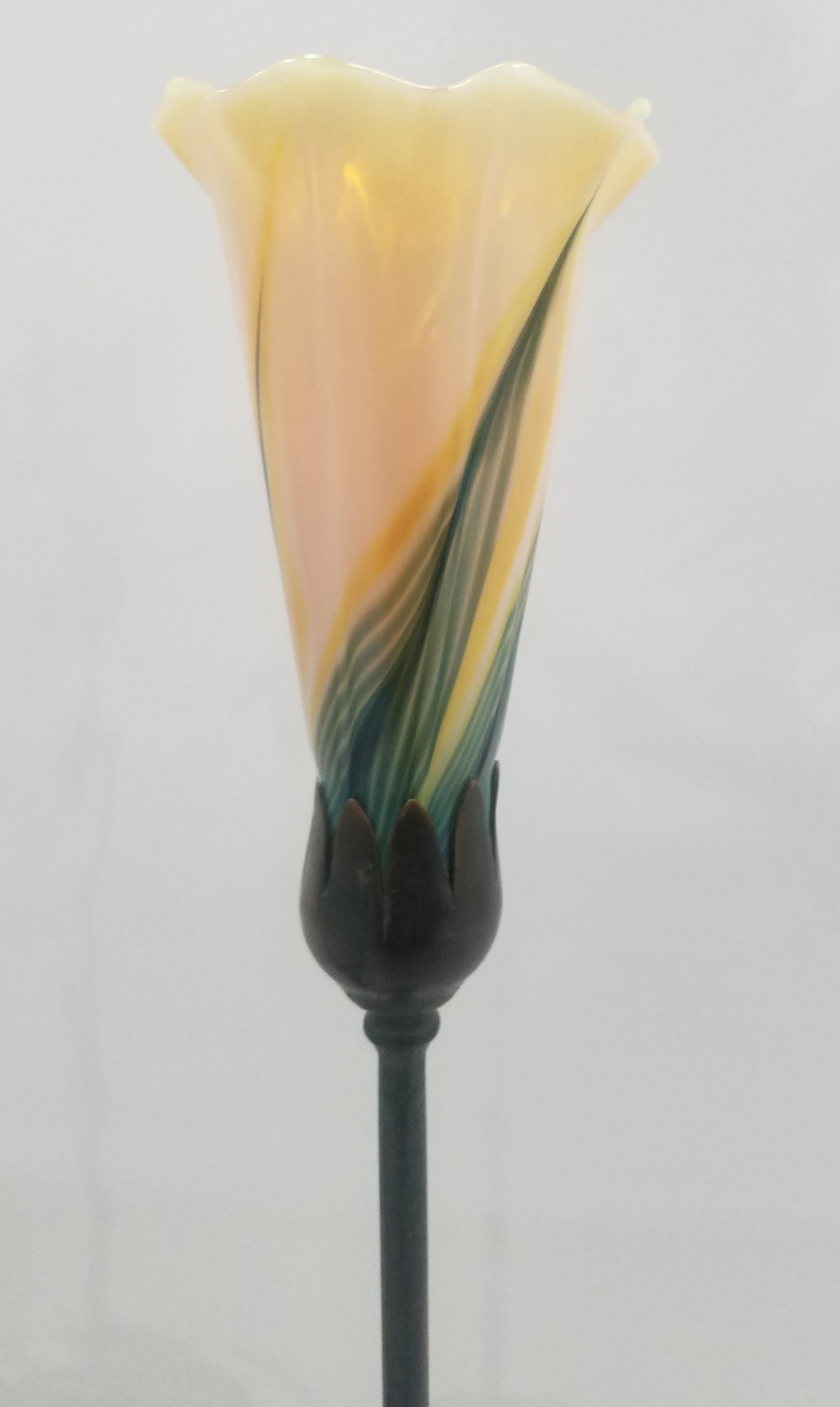 Pair of Aurora Studios Bronze and art glass table lamps

Art Nouveau style iridescent tulip motif art glass in manner of Tiffany Studios

Base 4.5