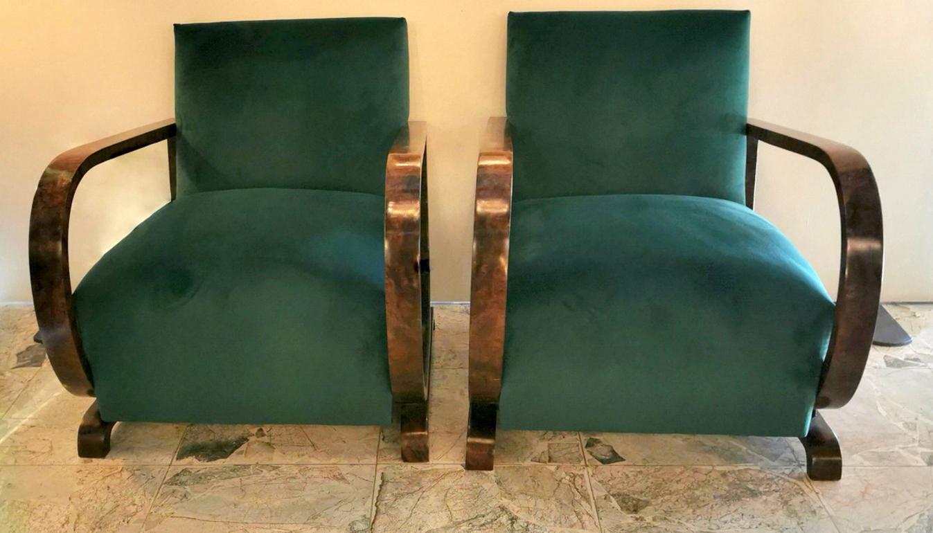 Beautiful Austrian armchairs; the structure is very solid and is made of walnut; they have been completely restored; they have been newly upholstered with an extremely elegant, high quality and very resistant green velvet; the seat is large, wide