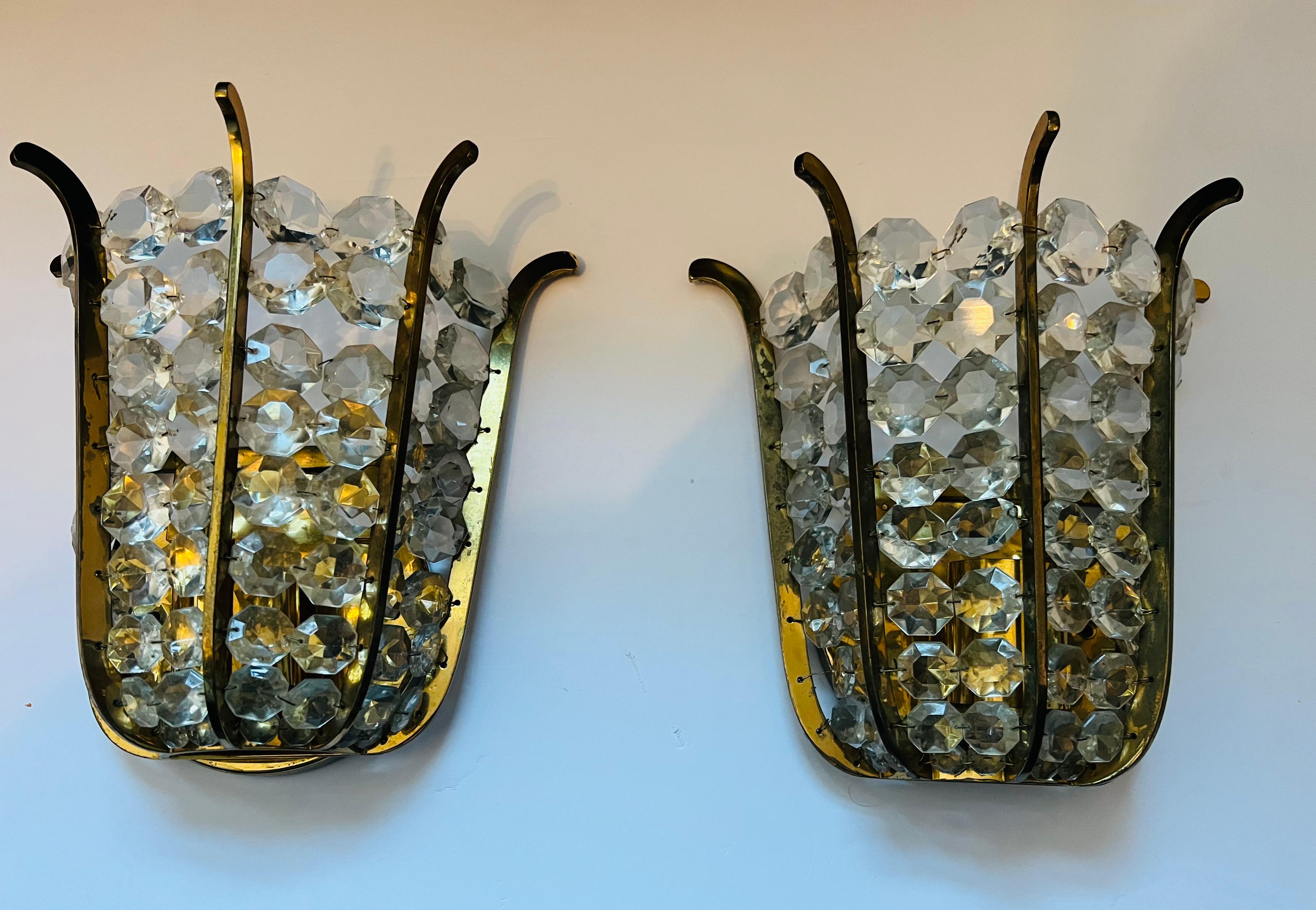 Pair of wonderful golden aged brass and Austrian crystal wall lights by Bakalowits. Rewired with one standard socket and arch up to 200 watts.