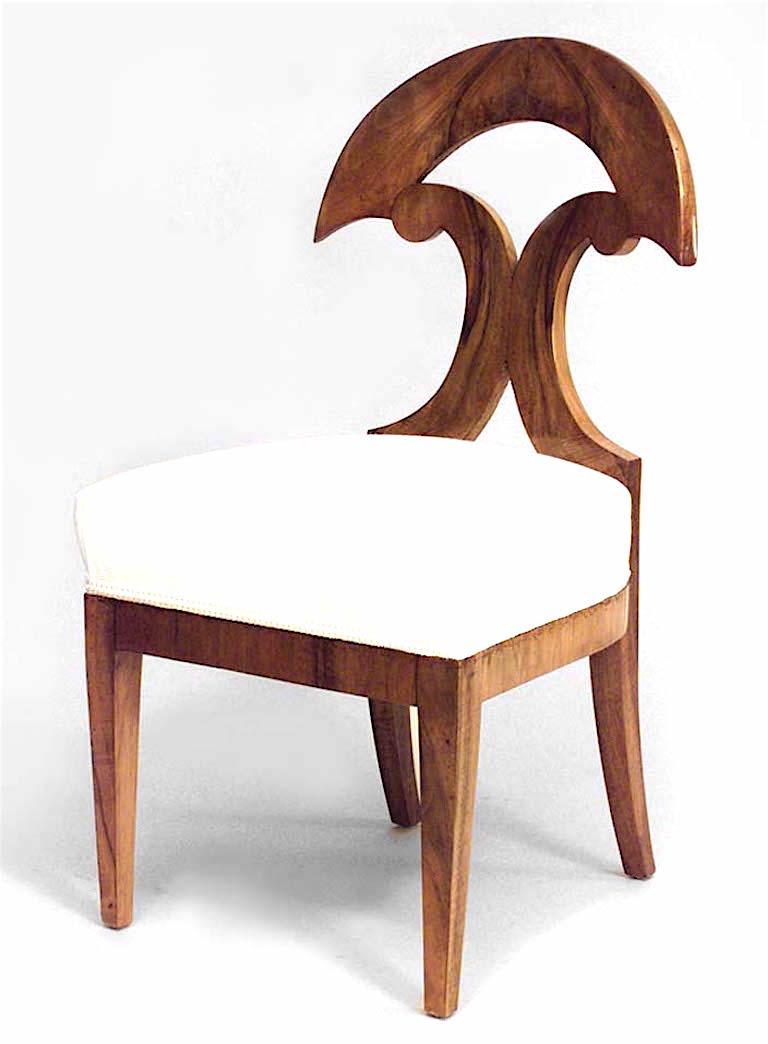 Pair of Austrian Biedermeier walnut veneer side chairs with half round and double scroll design back (Circa 1830)

