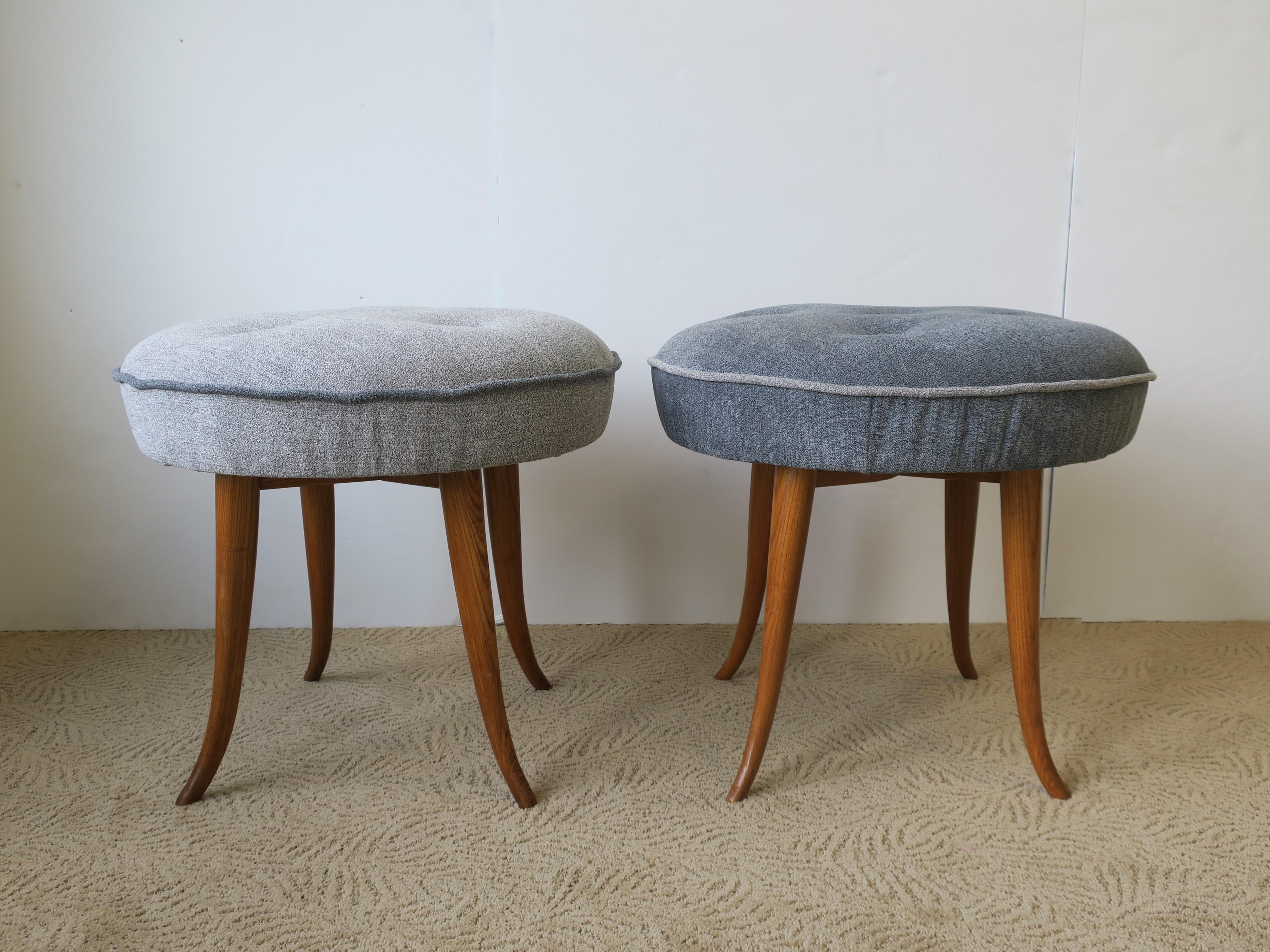 A beautiful pair of 20th century Austrian round upholstered wood stools or benches, in the style of designer Josef Frank, circa Mid-20th century or earlier, Austria. Stools have been newly/professionally reupholstered in a duo of blue (one light