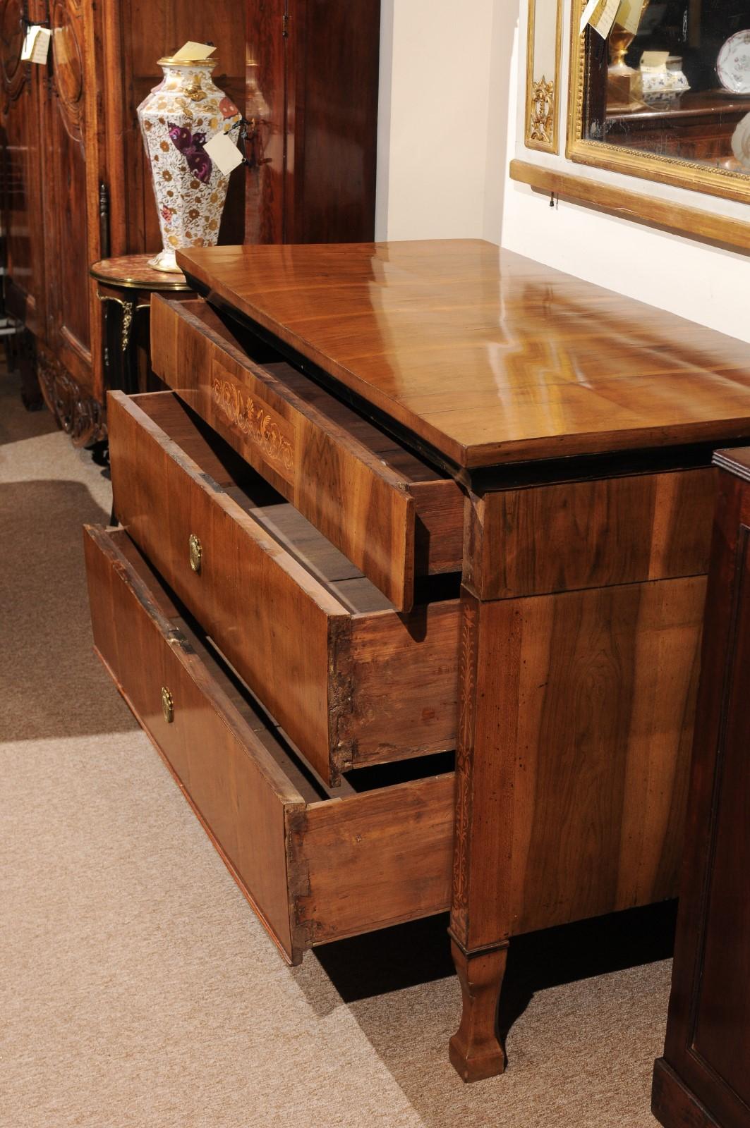 The pair of Austrian commodes in walnut commodes with three drawers, ebonized detail and marquetry inlay. 


 