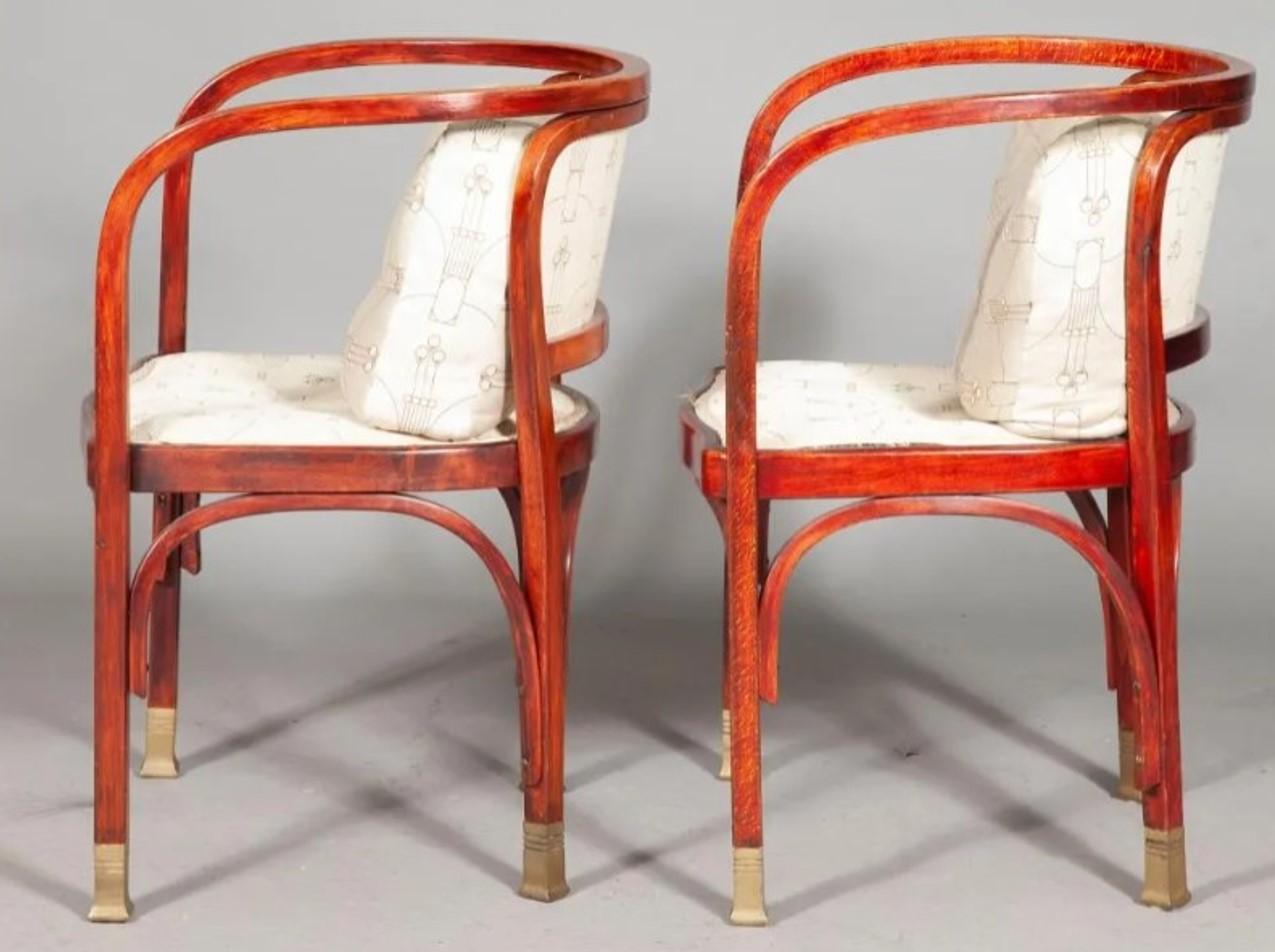 A Classic pair of Austrian Secessionist bentwood open armchairs.
The legs ending in brass sabots.
Paper label and also stamped JJ Kohn underside.