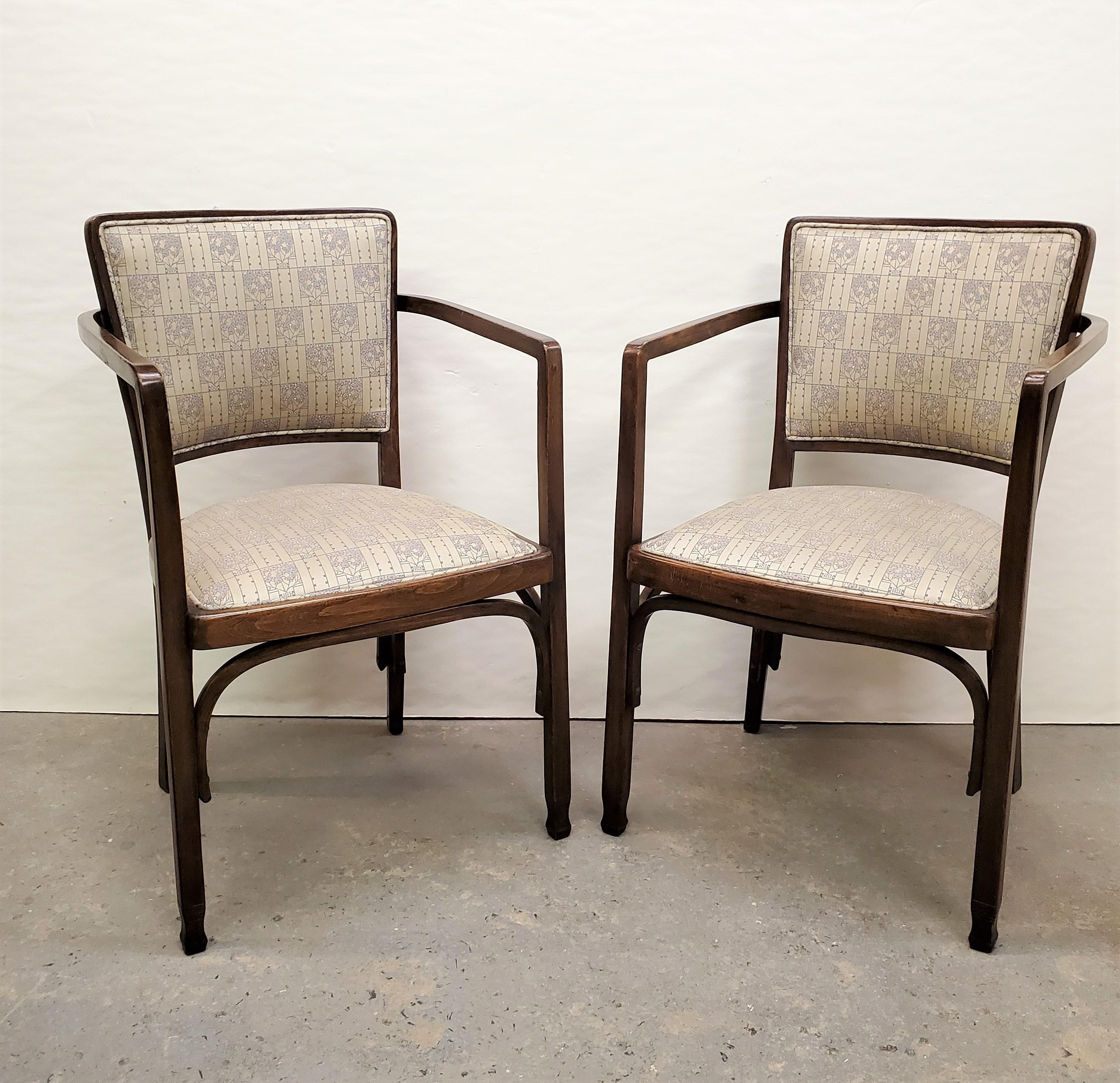 A fine pair of Austrian Secessionist bentwood chairs for a salon / living room, office, bedroom, foyer... in walnut stained beechwood with upholstered seat and back. 
Designed by Koloman Moser: March 30, 1868 – October 18, 1918
Manufactured by J &