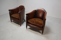 Pair of authentic De Coene Art Deco club chairs in leather and oak, circa 1920