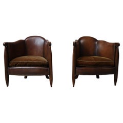 Pair of authentic De Coene Art Deco club chairs in leather and oak, circa 1920