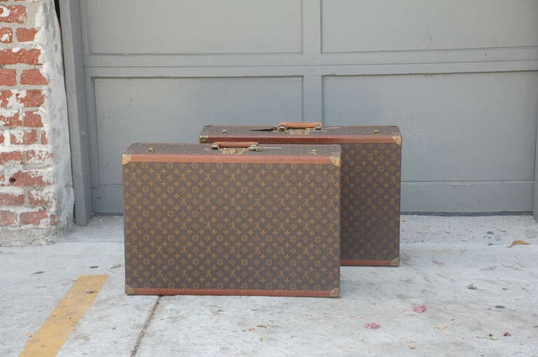 Pair of authentic Louis Vuitton luggage pieces.

Individually numbered, pair of brass numbered keys included with both pieces.

Can be mounted as side tables / nightstands.