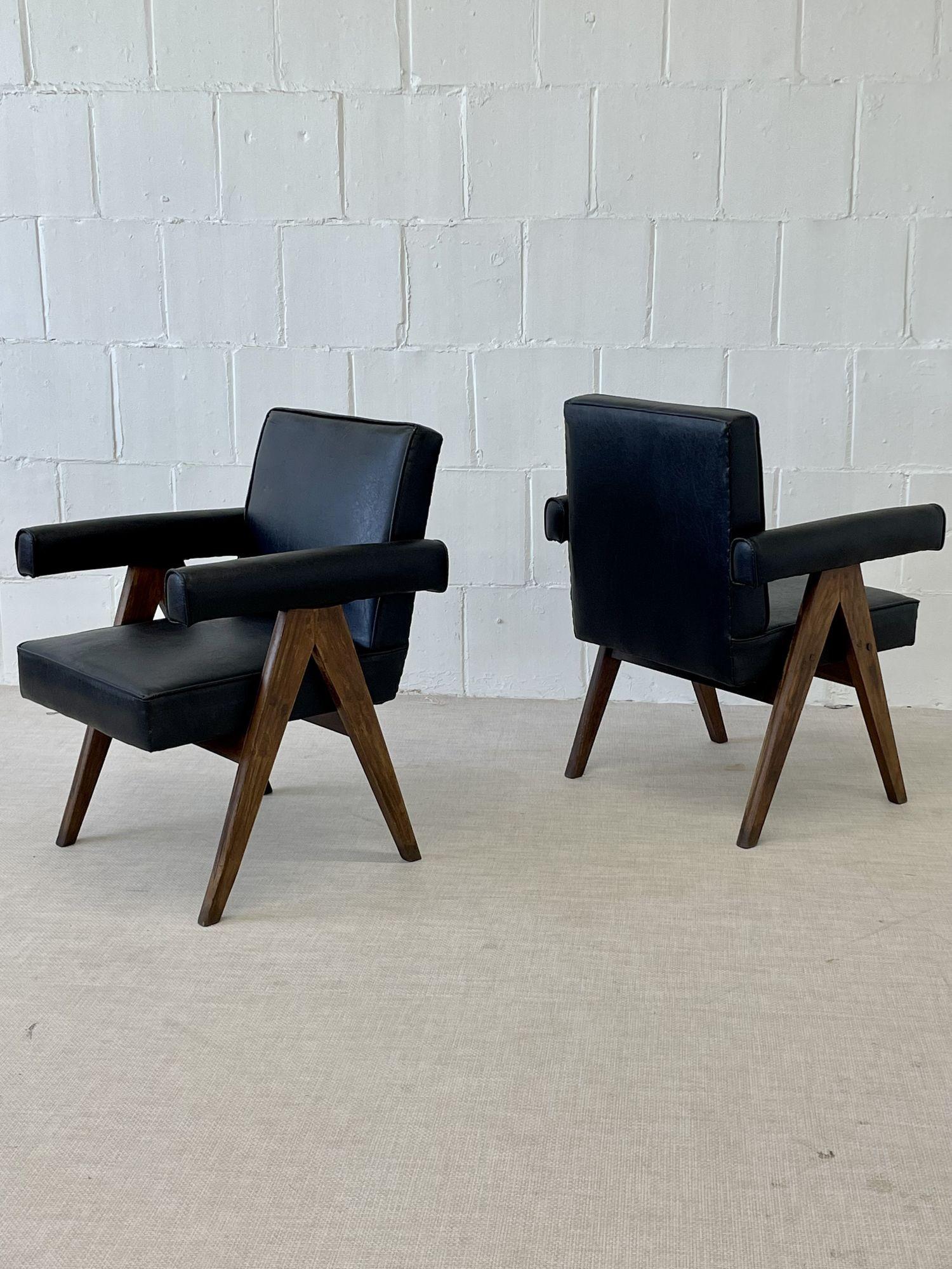 Pierre Jeanneret 'Committee' Chairs, Model PJ-SI-30-C
 
Pair of armchairs featuring slightly titled armrests and back sitting on a solid teak compass type side leg assembly. 
 
Provenance: High Court in Chandigarh, administrative buildings, Punjab
