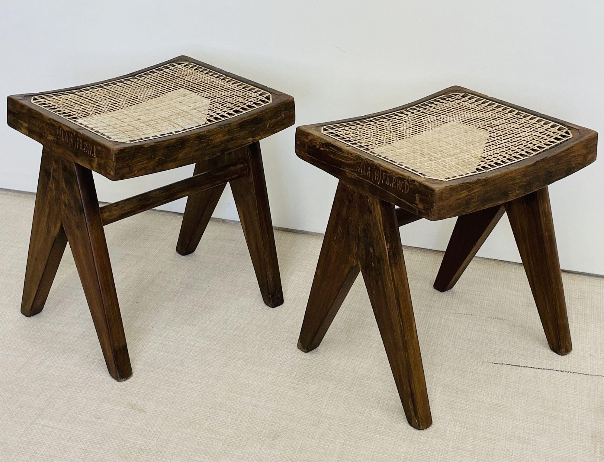 Pierre Jeanneret 'Low Stools,' Model PJ-SI-34-A 
 
Both stools or ottomans have a rectangular seat with a curved frame and a compass type double side leg assembly. 
 
France, India, c. 1960s
 
Each with markings indicating provenance - These are