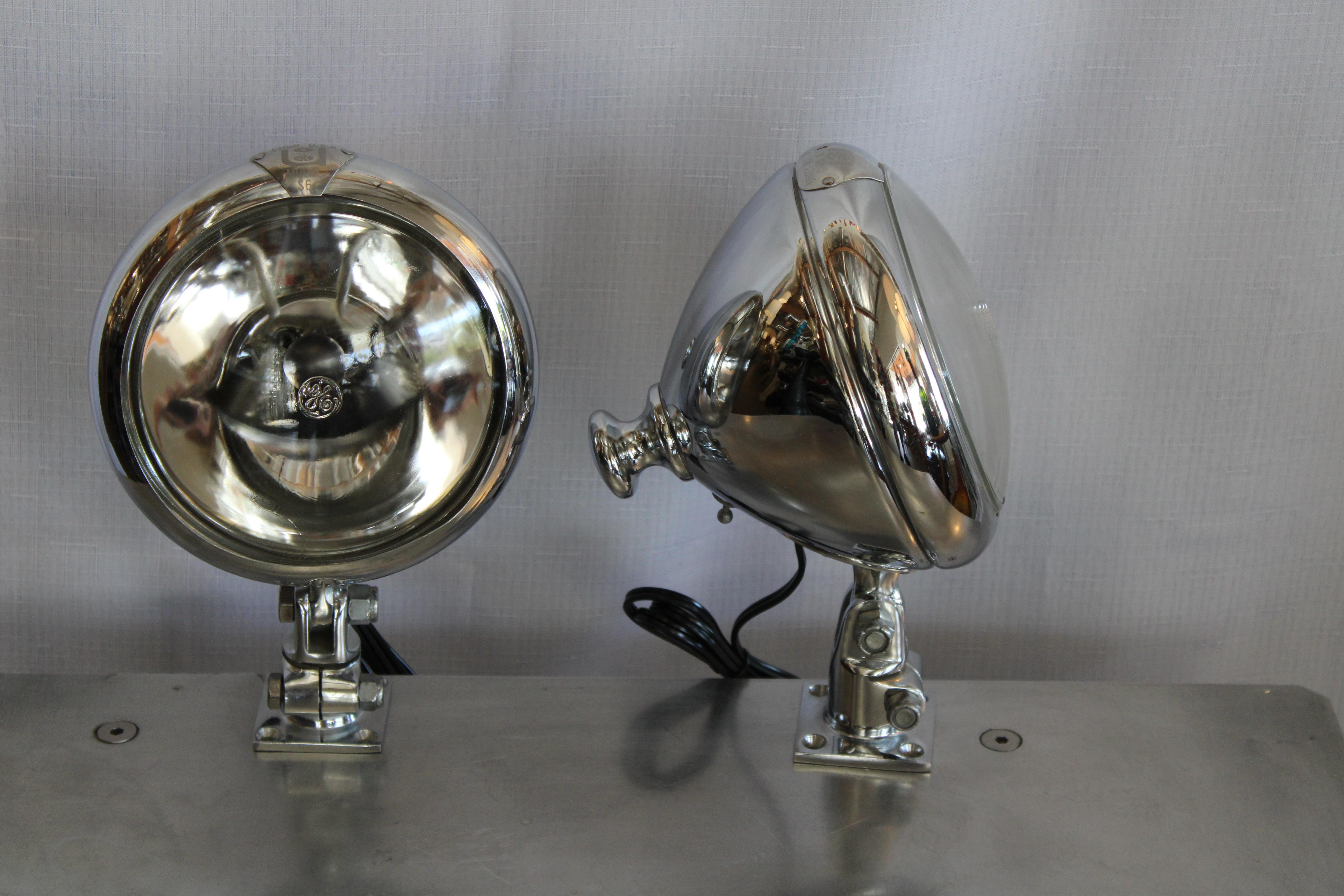 Great pair of vintage automobile style spotlights. Manufactured by Unity Manufacturing of Chicago IL. These were used mostly on Fire Trucks as their model (number S6) indicates. Iconic look where each lamp swivels and tilts on its solid base. Each