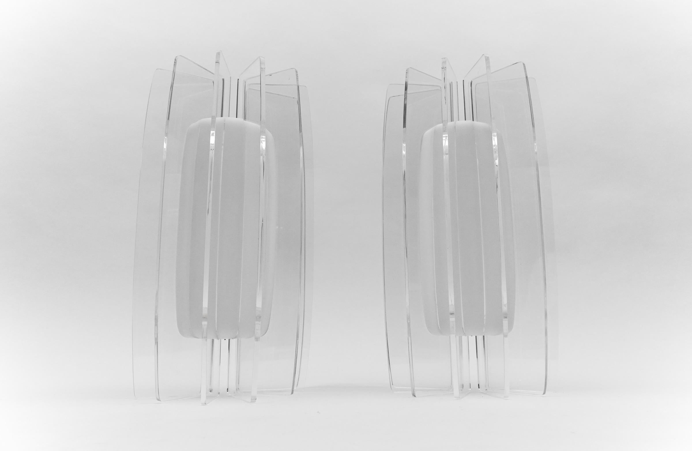 Pair of Awesome Large Acrylic Fan Wall Lamps, 1960s

The wall lamps come with each 2 x E14 / E15 Edison screw fit bulb holder, is wired and in working condition. It runs both on 110/230 Volt. Delivery without bulb.

Our lamps are checked, cleaned