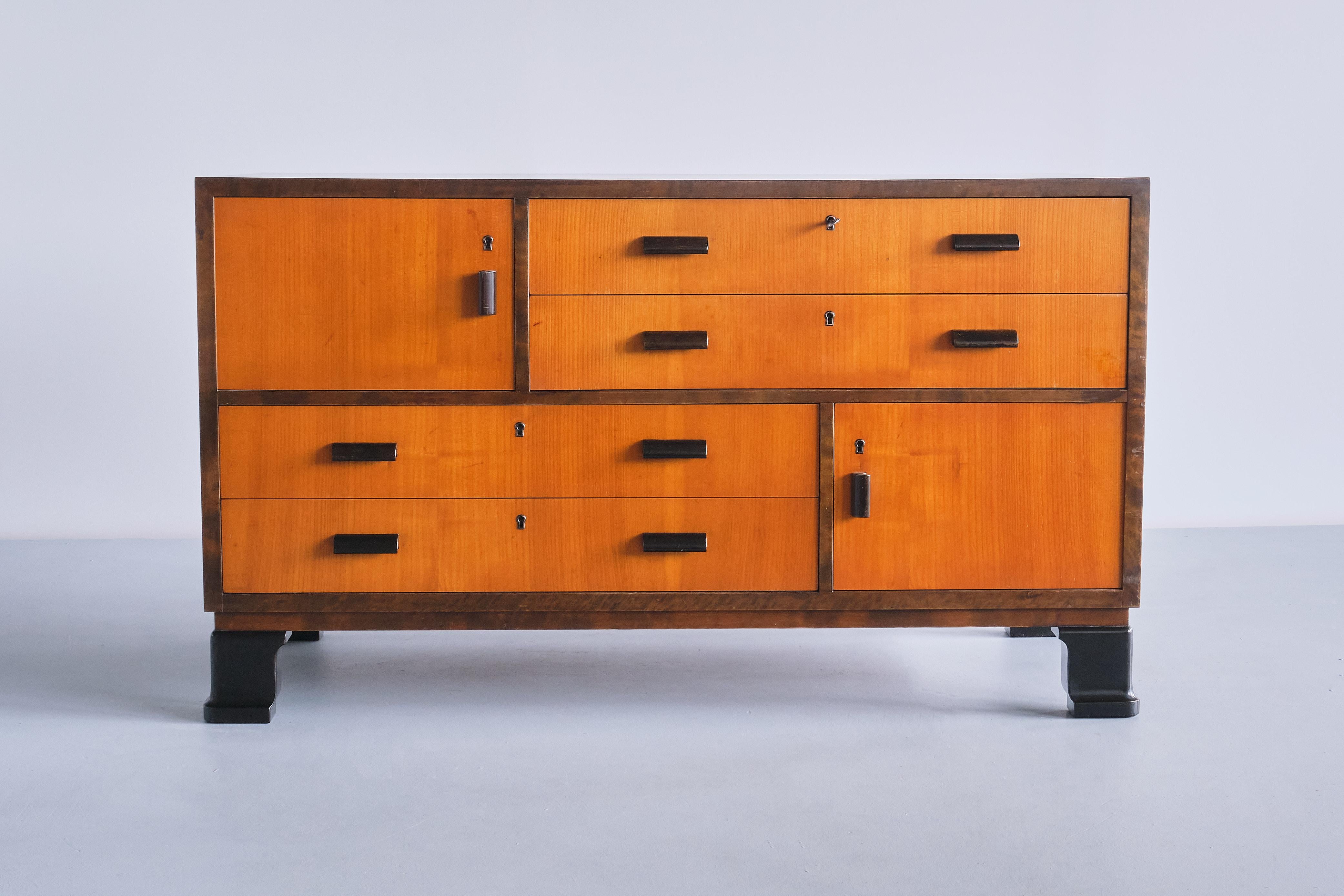 This rare pair of sideboards/ chests of drawers was designed by the Swedish designer Axel Larsson. They were produced by SMF Svenska Möbelfabriken in Bodafors, Sweden in the 1940s. The pieces are marked with the manufacturer's company plate.

The