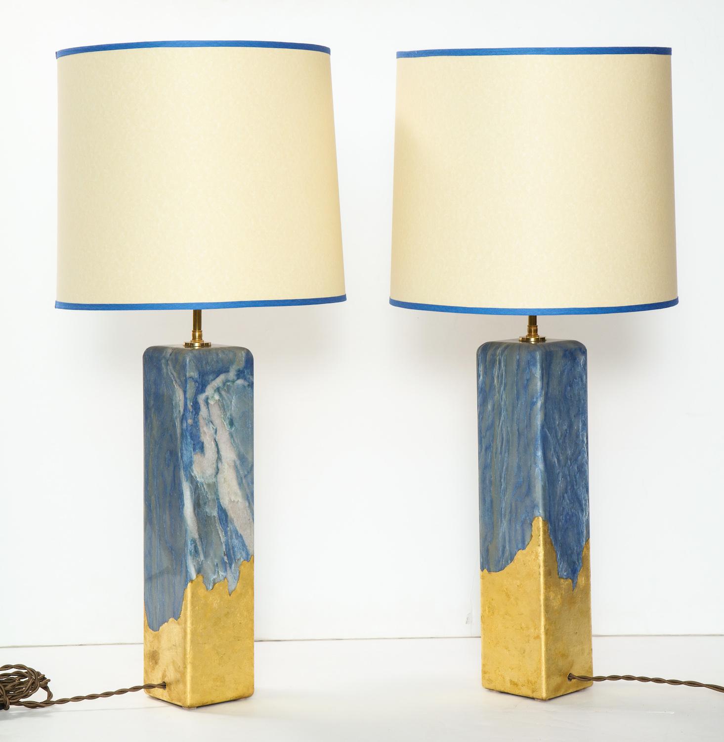 Solid stone lamps of Azul Macaubus with rounded corners and gold-leaf around the lower portion by Arriau. Each lamp has 2 standard sockets that swivel. These lamps are made per order in France and require 12-15 weeks lead time. Shade diameter is 18