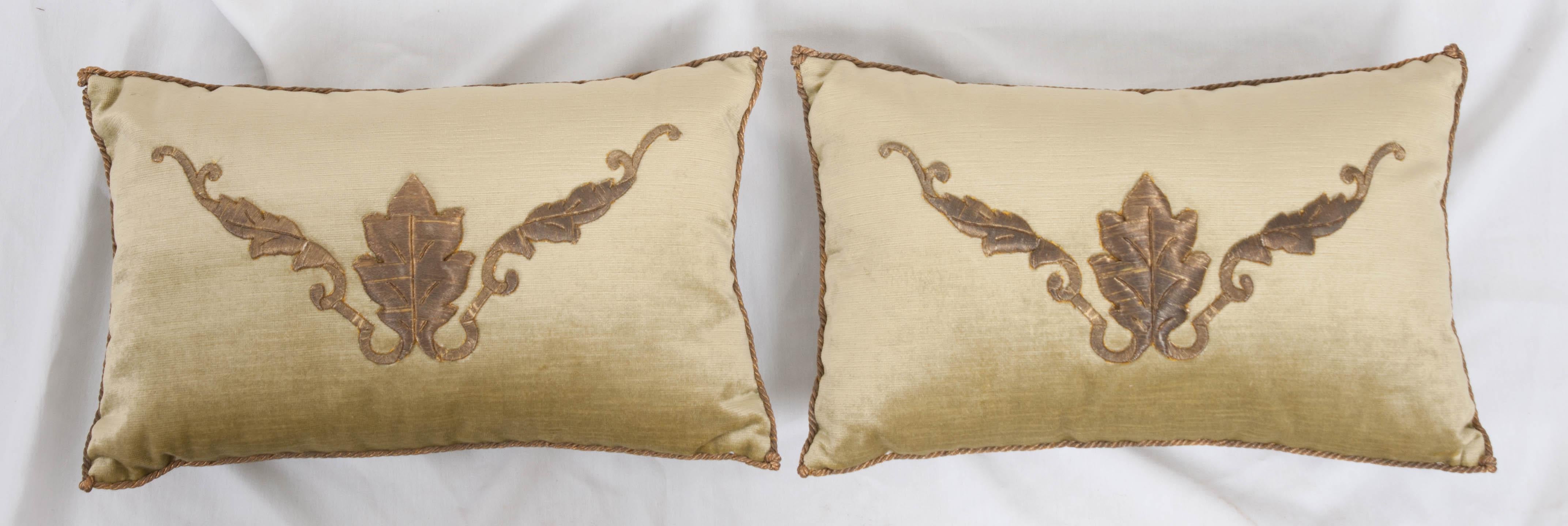 Antique European raised gold metallic embroidery on pale chartreuse velvet, hand-trimmed with gold metallic cording which is knotted at the corners. Down-filled. Designed by Rebecca Vizard for V. Biz Design. Available for individual purchase at