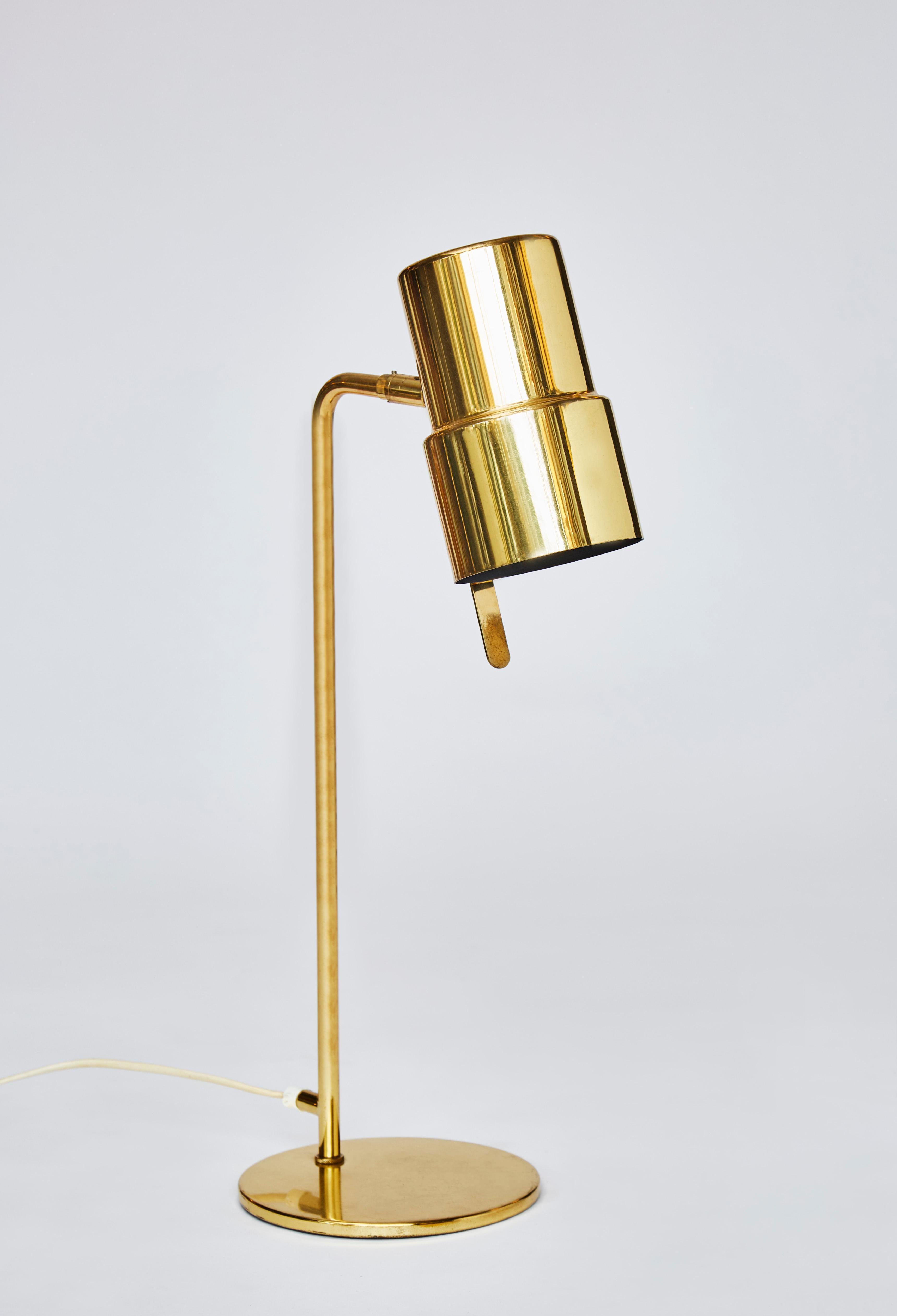 Pair of B195/2 table lamps designed by Hans Agne Jakobsson in brass, round foot and adjustable sconce.