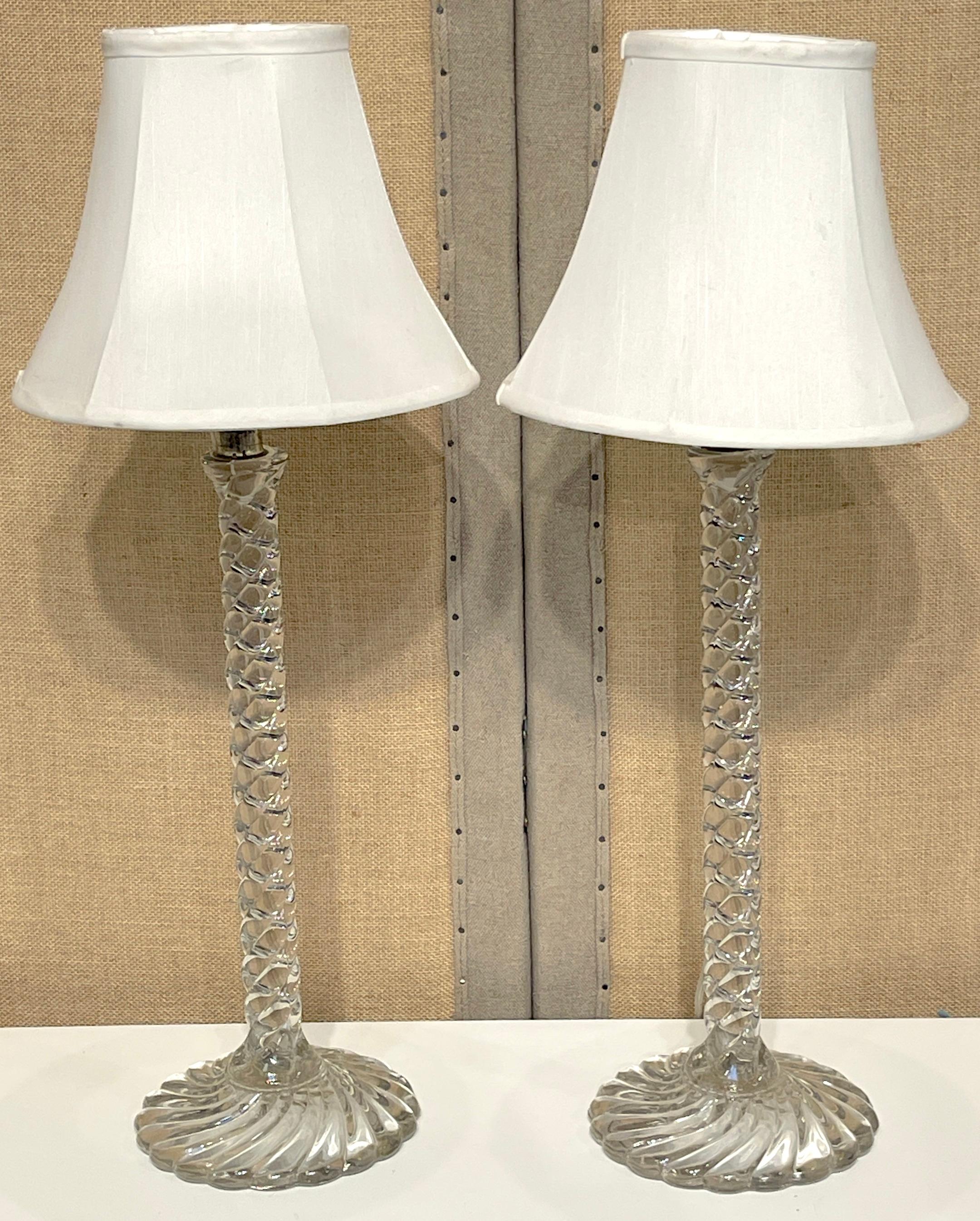 Pair of Baccarat 'Bamboo' Pattern Crystal Candlesticks, Now as Lamps 
France, late 19th century, late 20th century 

From late 19th-century France, this pair of Baccarat 'Bamboo' pattern crystal candlesticks has been elegantly repurposed as lamps in