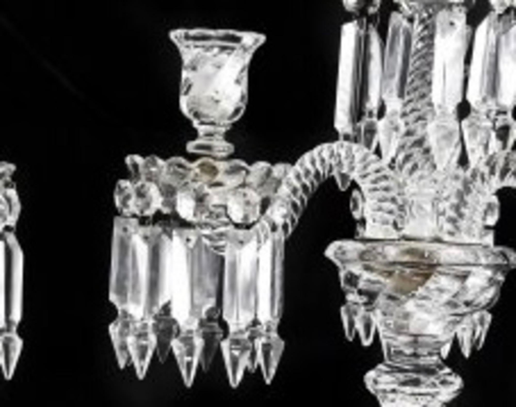 A pair of Baccarat molded and cut glass four-light candelabra, each with molded Baccarat mark.
Measures: Height 20 1/2 in.
 