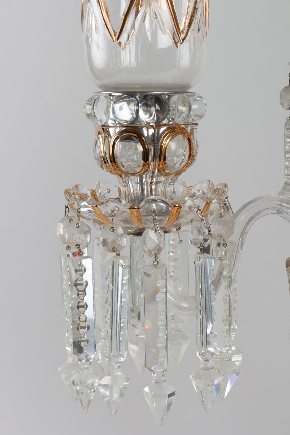 Pair of Baccarat candelabra with three arms of light decorated with pendants and topped with engraved tulips and painted flowers with engraved and gilded wavy contours.
Measures: Height 63cm, width 41cm.