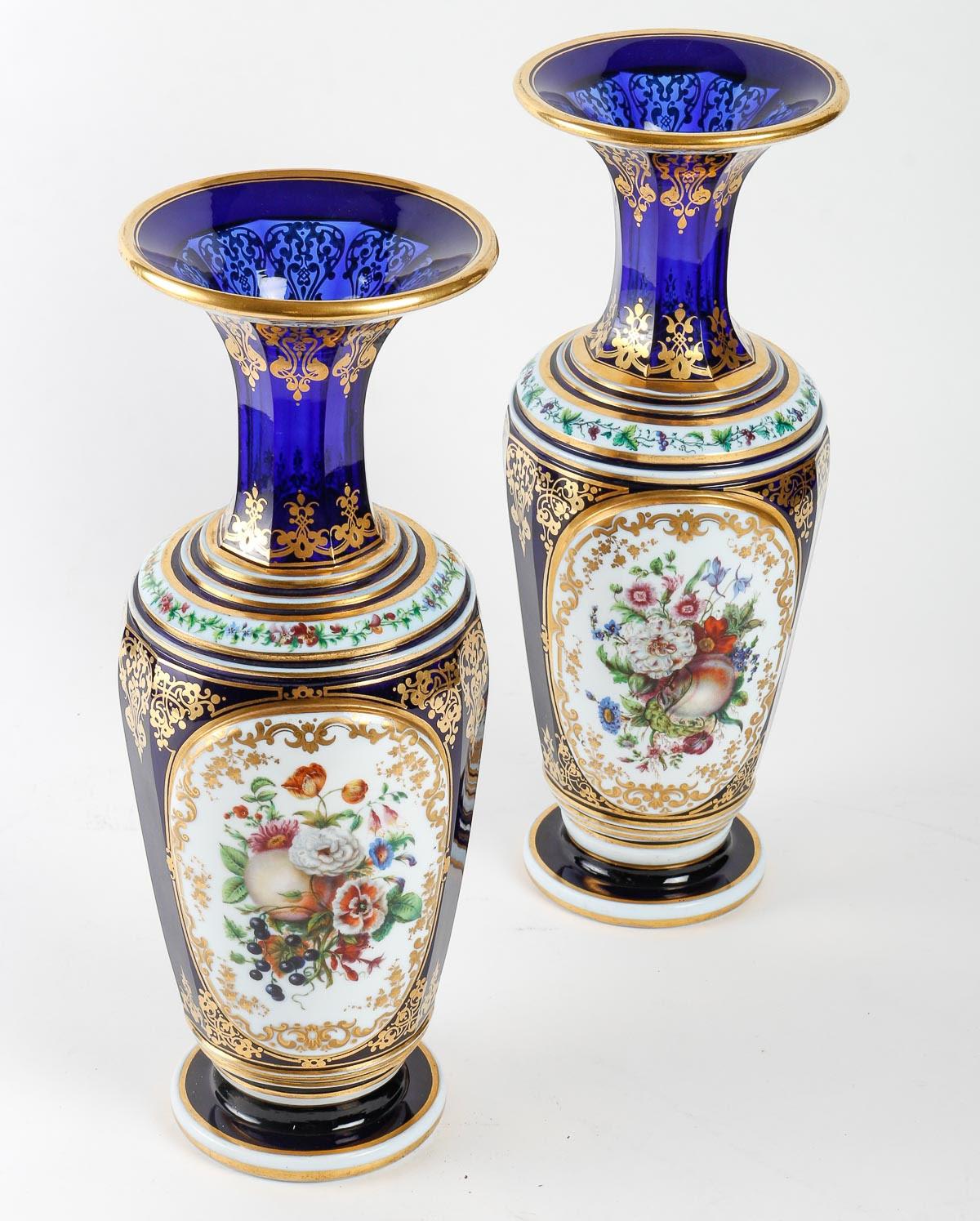 Pair of Baccarat crystal and painted opaline vases, Napoleon III period.

A pair of Baccarat crystal and opaline vases painted with floral decorations and enhanced with gold, 19th century, Napoleon III period.

H: 36cm, D: 14cm
