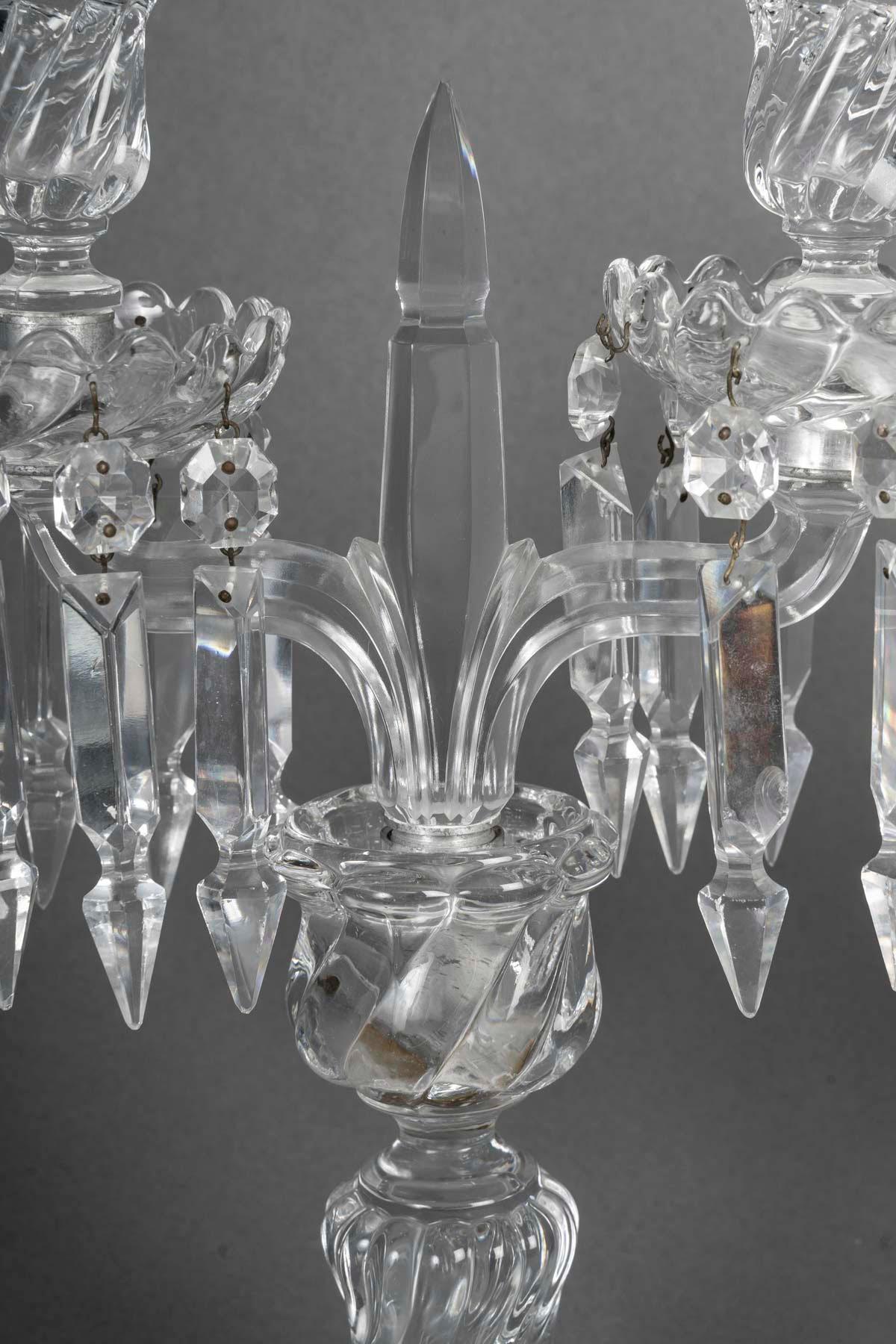 Pair of Baccarat cut crystal candelabra, 19th century, Napoleon III period.

A pair of Baccarat cut crystal 2-light candelabra, 19th century, Napoleon III period.
H: 33cm. W: 23,5cm, D: 13cm