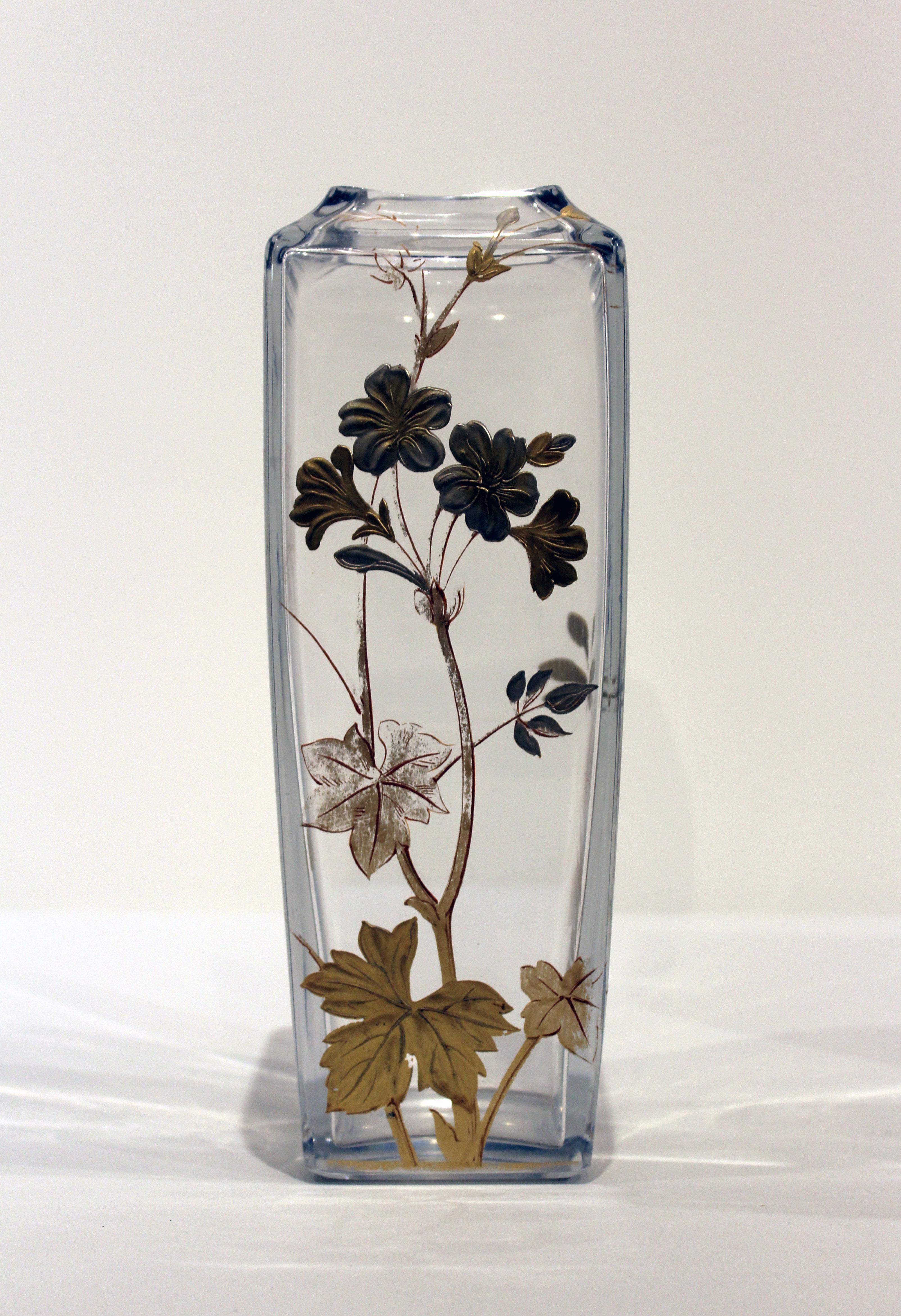 Pair of early 20th century signed Baccarat glass vases with gilded and silver raised flowers.