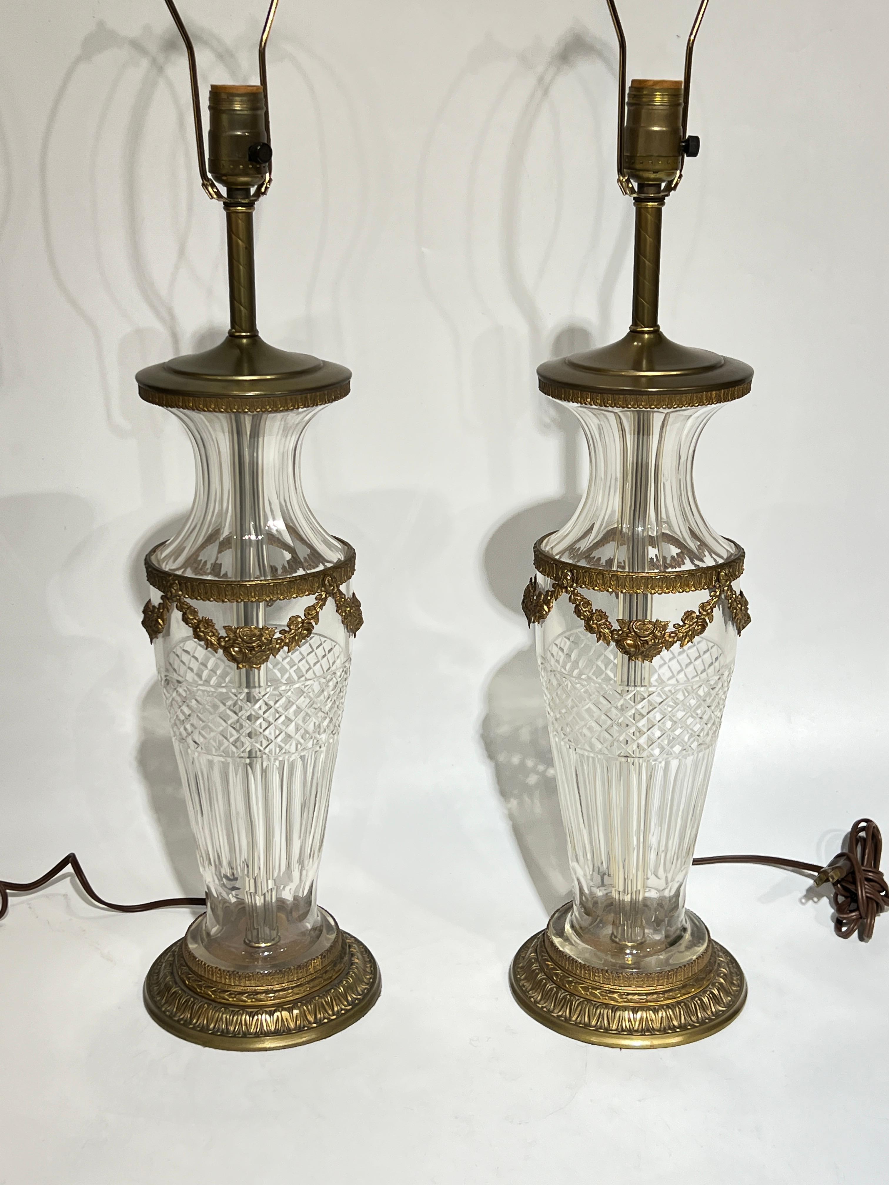 Fine pair of French Baccarat style crystal and gilt bronze  Table Lamps including floral swags.