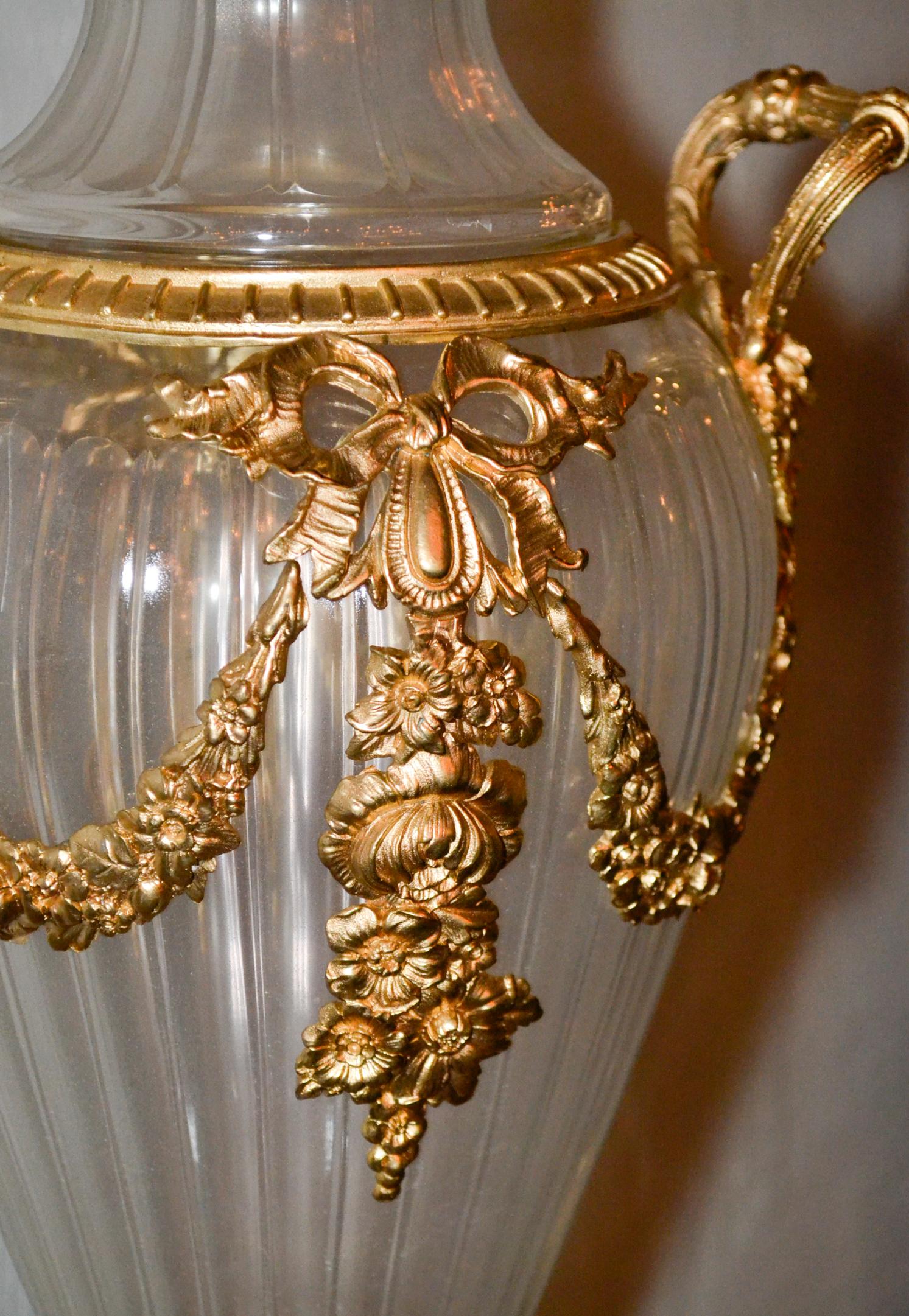 Nice pair of Baccarat style gilt bronze and crystal lidded vases.