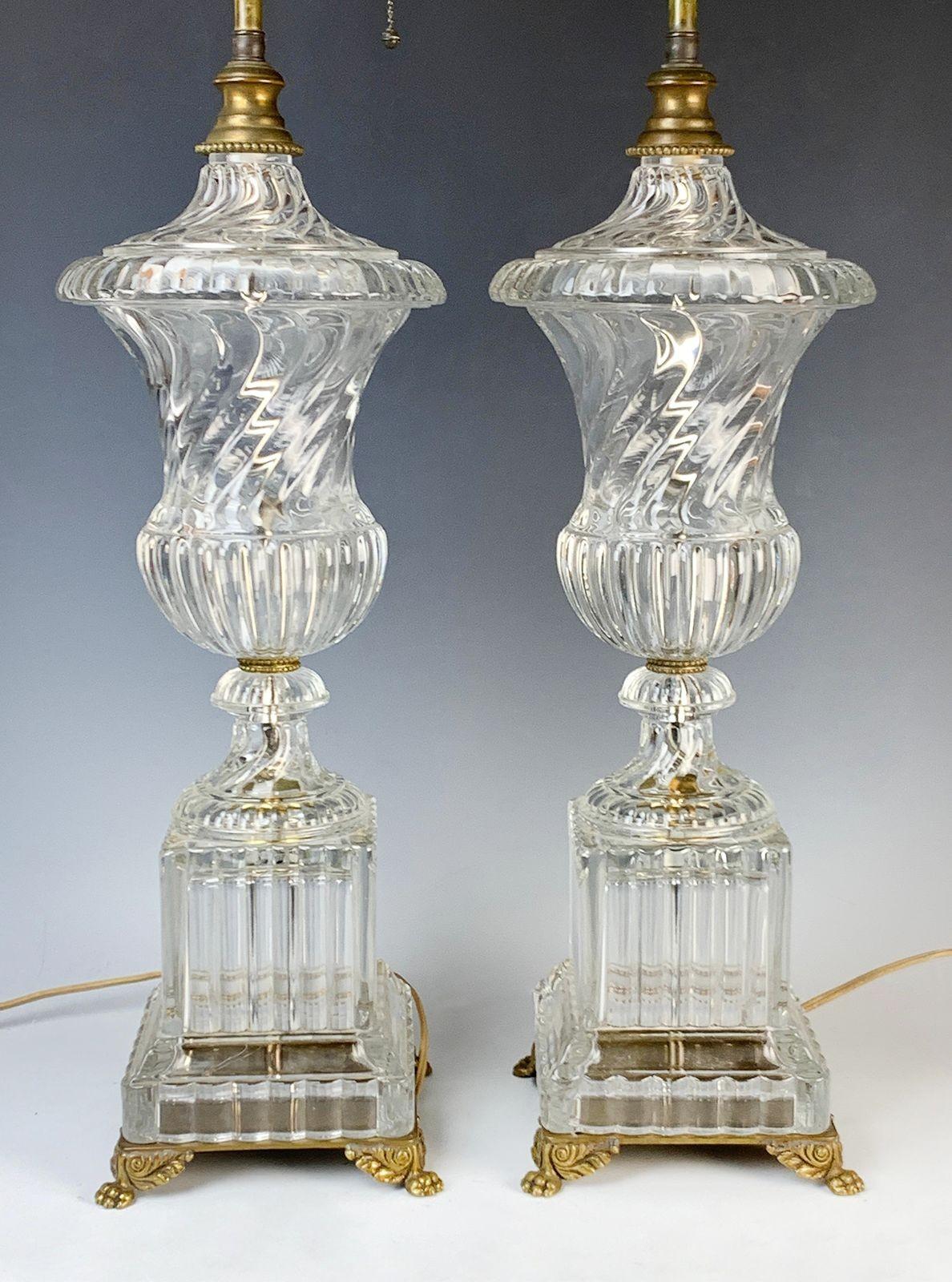 Pair of Baccarat swirl crystal table lamps. Made in France, c. 1920's. Complementing the luminous crystal, the lamps are adorned with finely bronze accents.
*Rewired to fit US lighting standards
Dimensions:
39.5