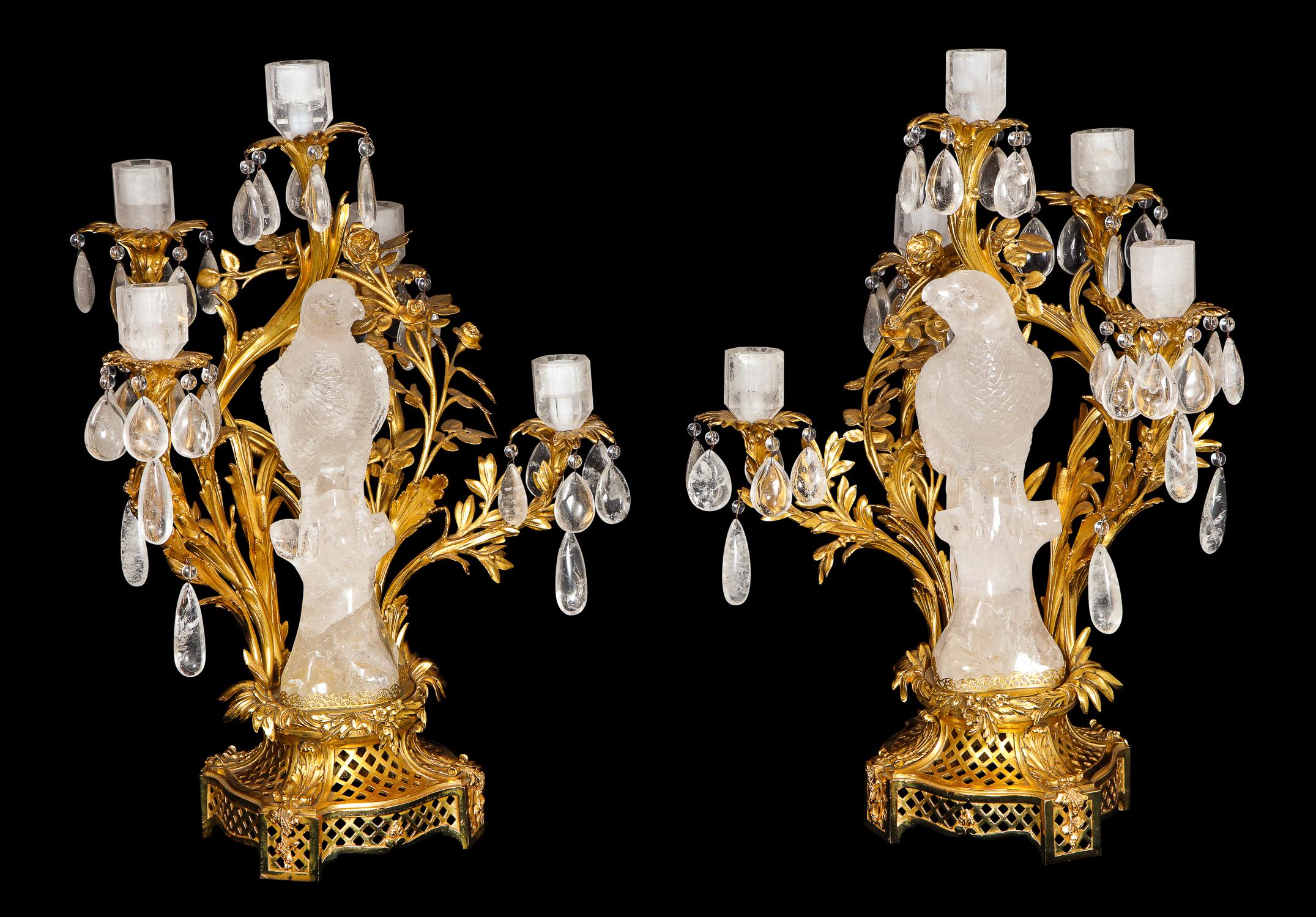 A pair of spectacular and highly important rare antique French Louis XVI style gilt bronze-mounted cut rock crystal parrot candelabras/lamps of exquisite craftsmanship embellished with the most unique hand-carved rock crystal parrots mounted in fine
