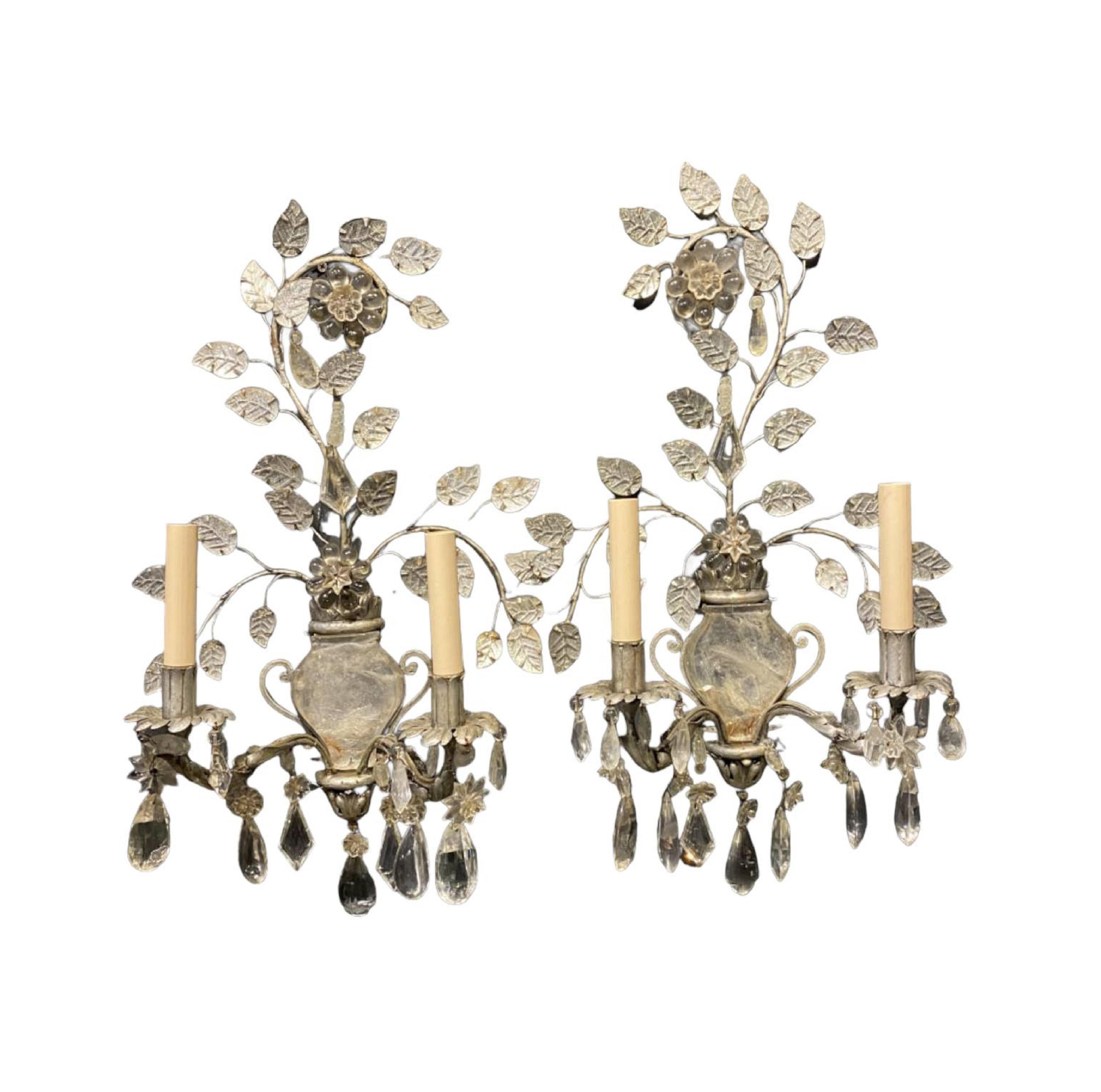 A pair of 1920’s French silvered metal Baguès sconces with rock crystal hangings and body. In very good vintage condition. Up to 120V (US Standard):Hardwired. 

Dealer: G302YP