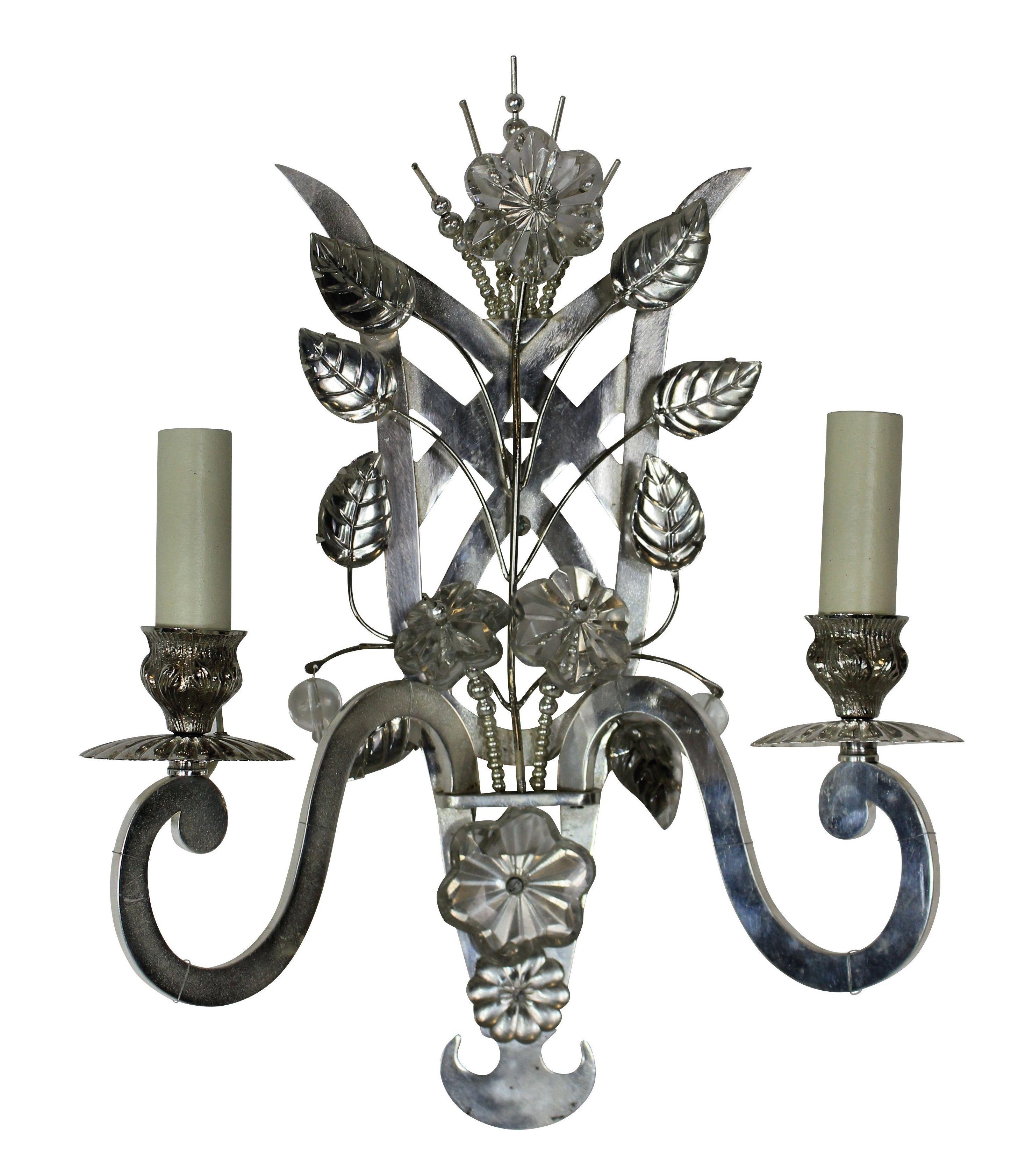 A pair of French wall sconces in the style of Baguès, in silver plate and with cut and moulded glass leaves and foliage.