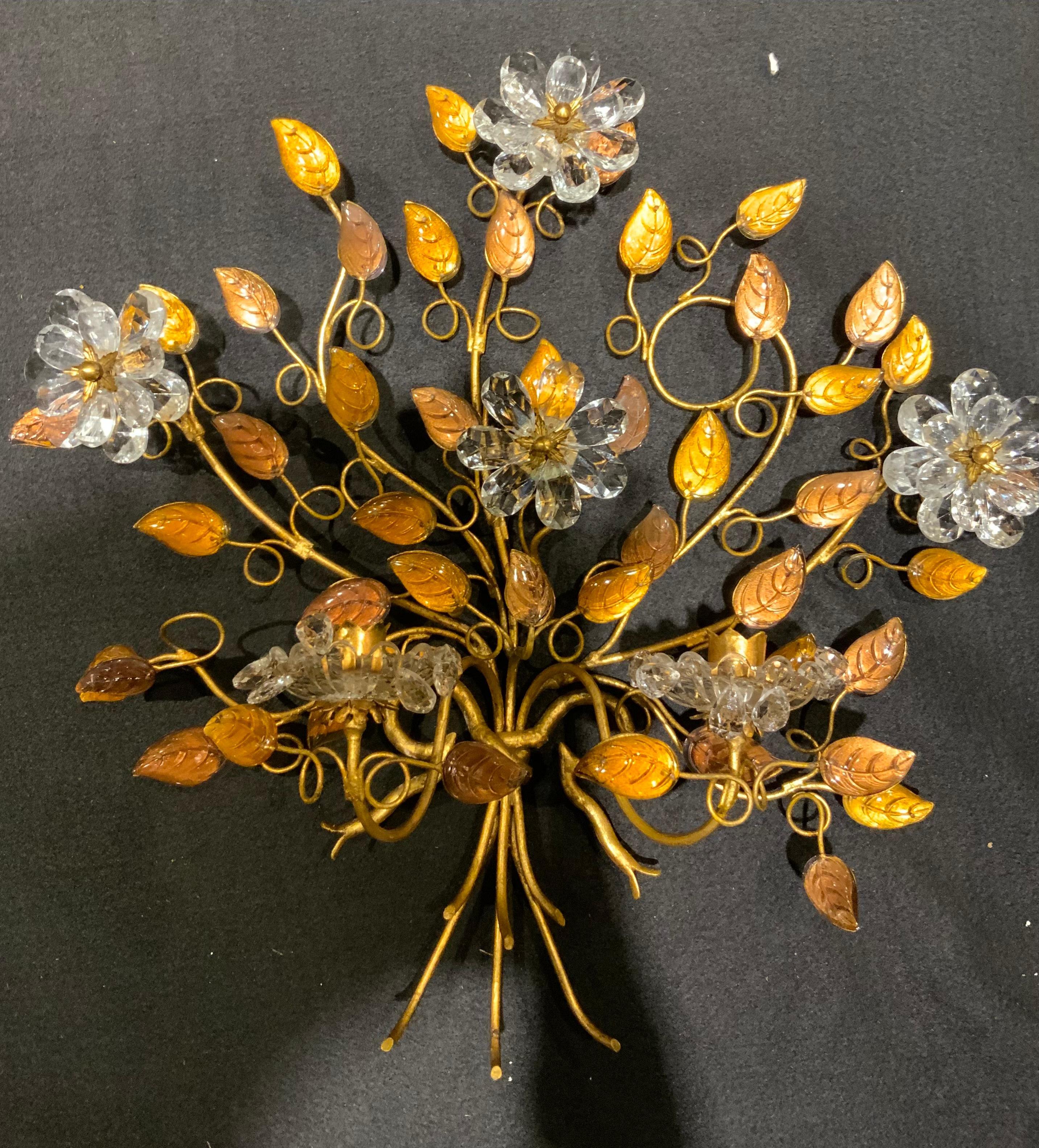 These are unique because they have a scrolled form that is Freeform. 

The leaves are two shades of gold. One shade is light gold and the deeper color is a copper hue. 
Each sconce has a candle cup for two candles. 
They have never been wired.