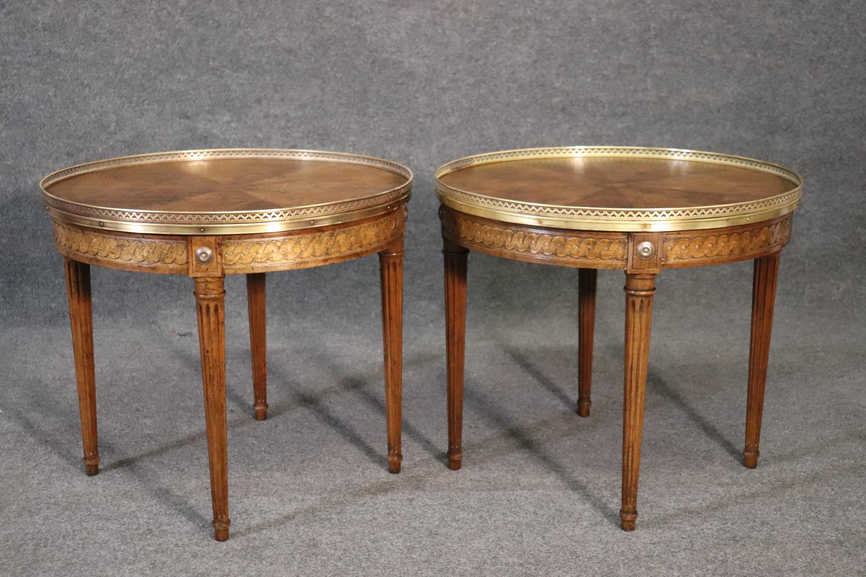 These are absolutely beautiful end tables from Baker furniture. The tables are in very good condition and have no major issues of any kind. The tables are beautifully designed with expertly carved walnut frames and beautiful walnut marquetry on top,
