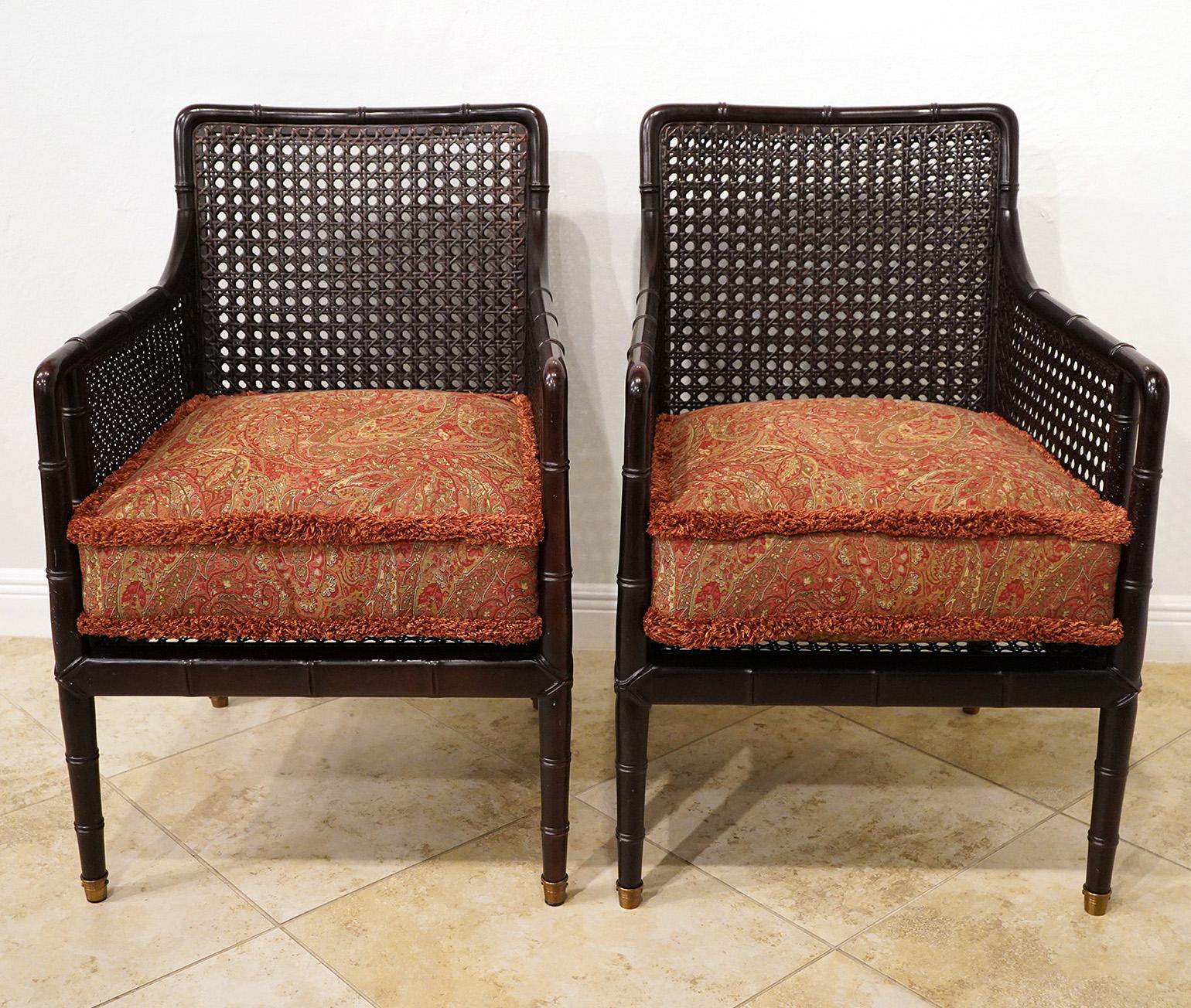 Pair of Baker Lounge chairs. Labeled on the bottom.  Chairs are a campaign style with a faux bamboo look. 38