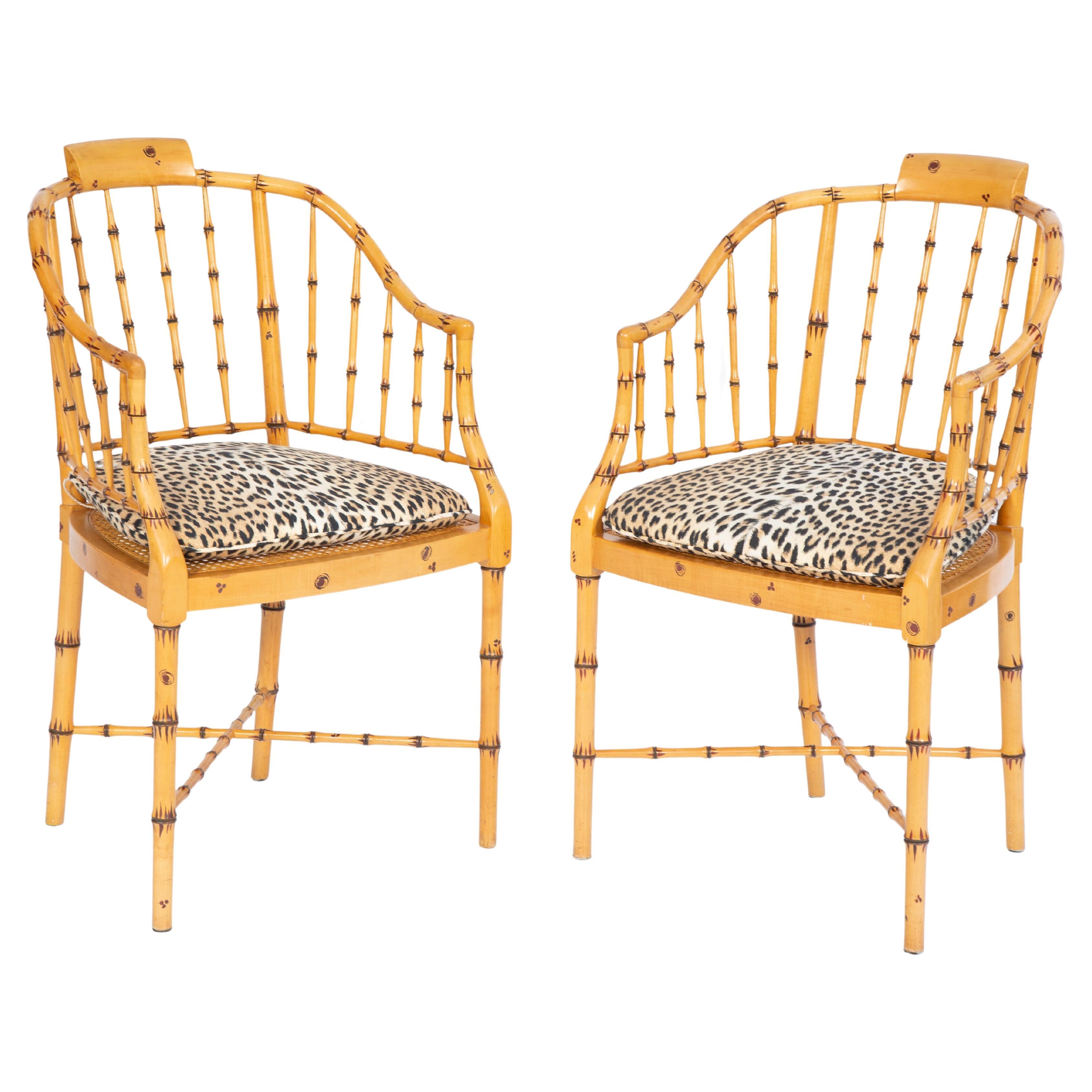 Pair of Baker Faux Bamboo Armchairs with Caned Seats and Leopard Cushions