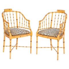 Pair of Baker Faux Bamboo Armchairs with Caned Seats and Leopard Cushions