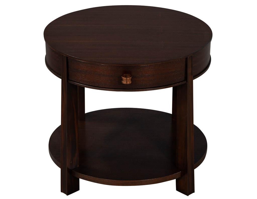Pair of Baker Furniture Barbara Barry ranch lamp tables. Round mahogany tops with single storage drawer. Featuring unique styling with bottom tier storage area.

Price includes complimentary curb side delivery to the continental USA.