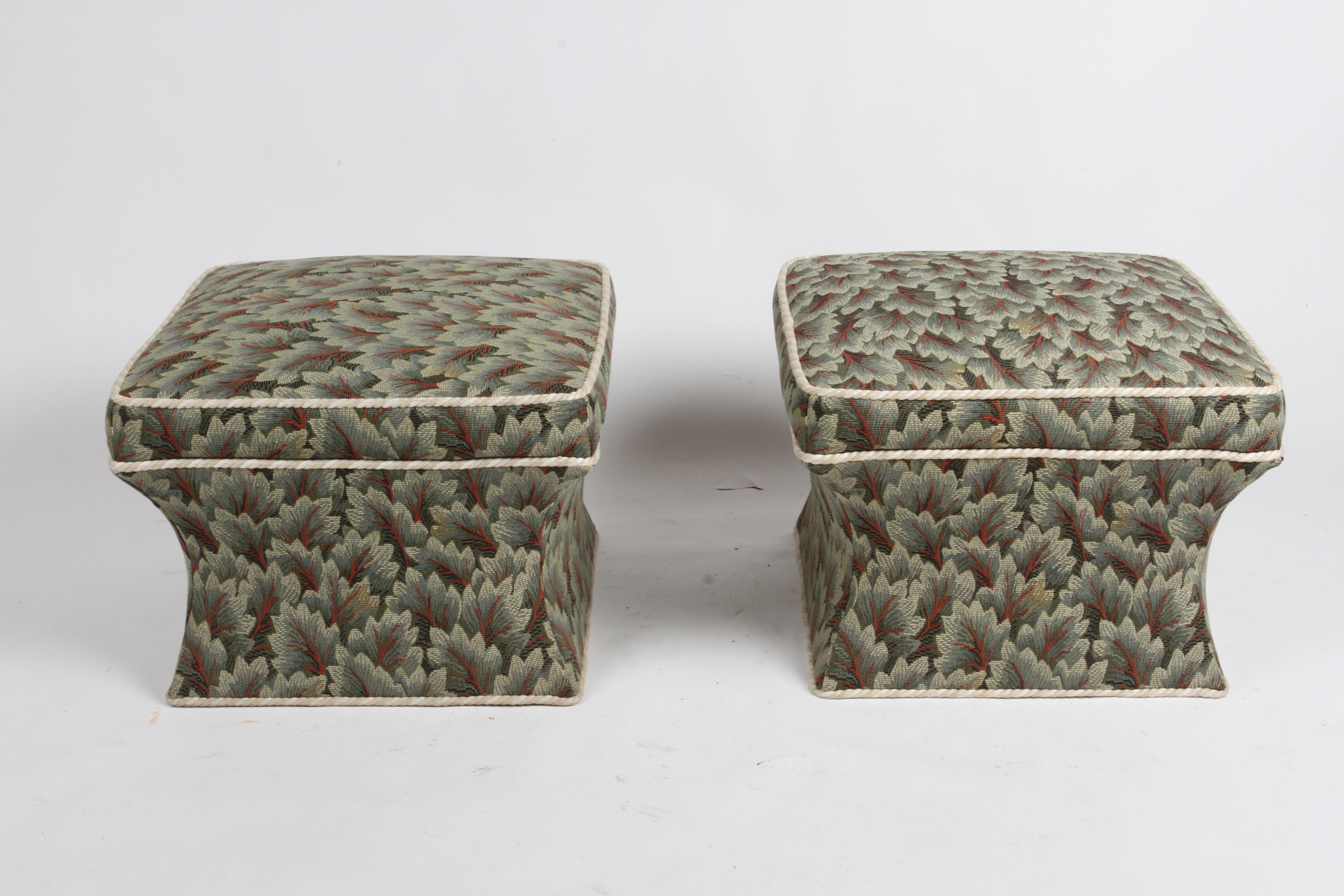 Pair of Baker Furniture Company sculpted ottomans or poufs circa late 1970s or early 1980s with vintage Chintz floral and rope welt upholstery. I think the form of these are stunning, I would update the upholstery, but according to the New York