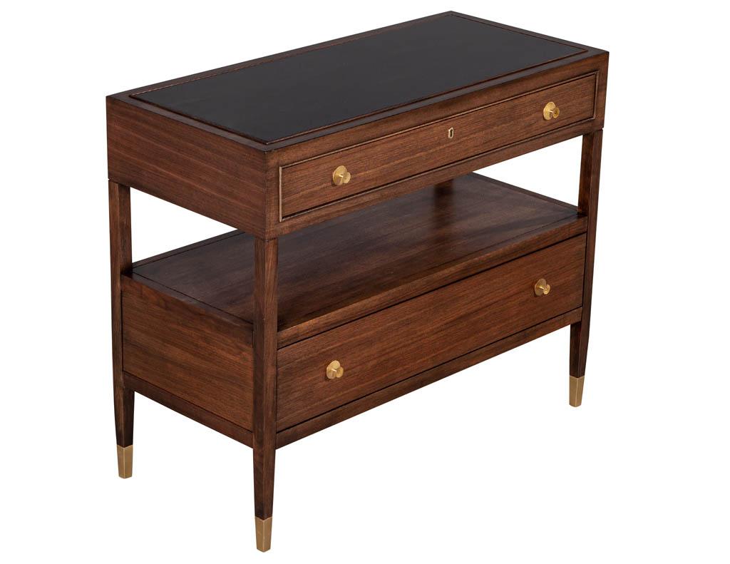 Pair of Baker Furniture modern walnut chests. Featuring black lacquer top with clean brass hardware and foot caps. Finished in a natural walnut color.

Price includes complimentary scheduled curb side delivery service to the continental USA.