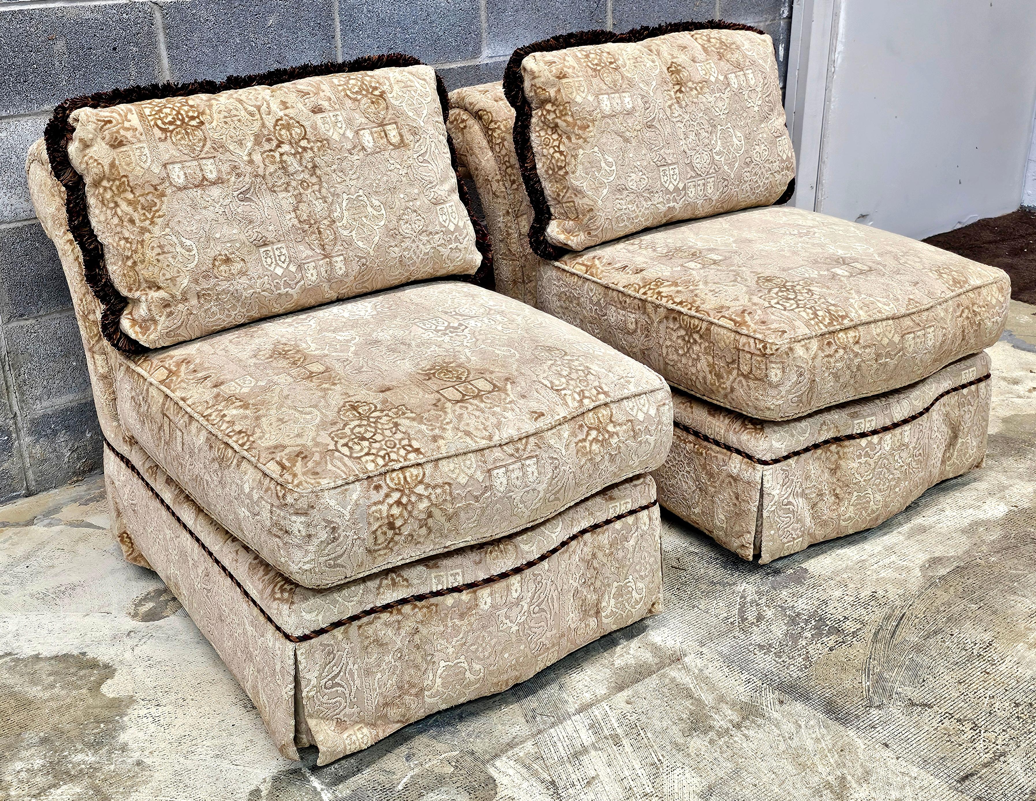 A luxurious Pair of Baker Furniture attributed Roll Back Plush Upholstered Slipper Chairs. Plush and firm seat. Double clasps hold seat cushion from slipping off the seat. Optional back cushion included. Golden brown color.
Measures 27