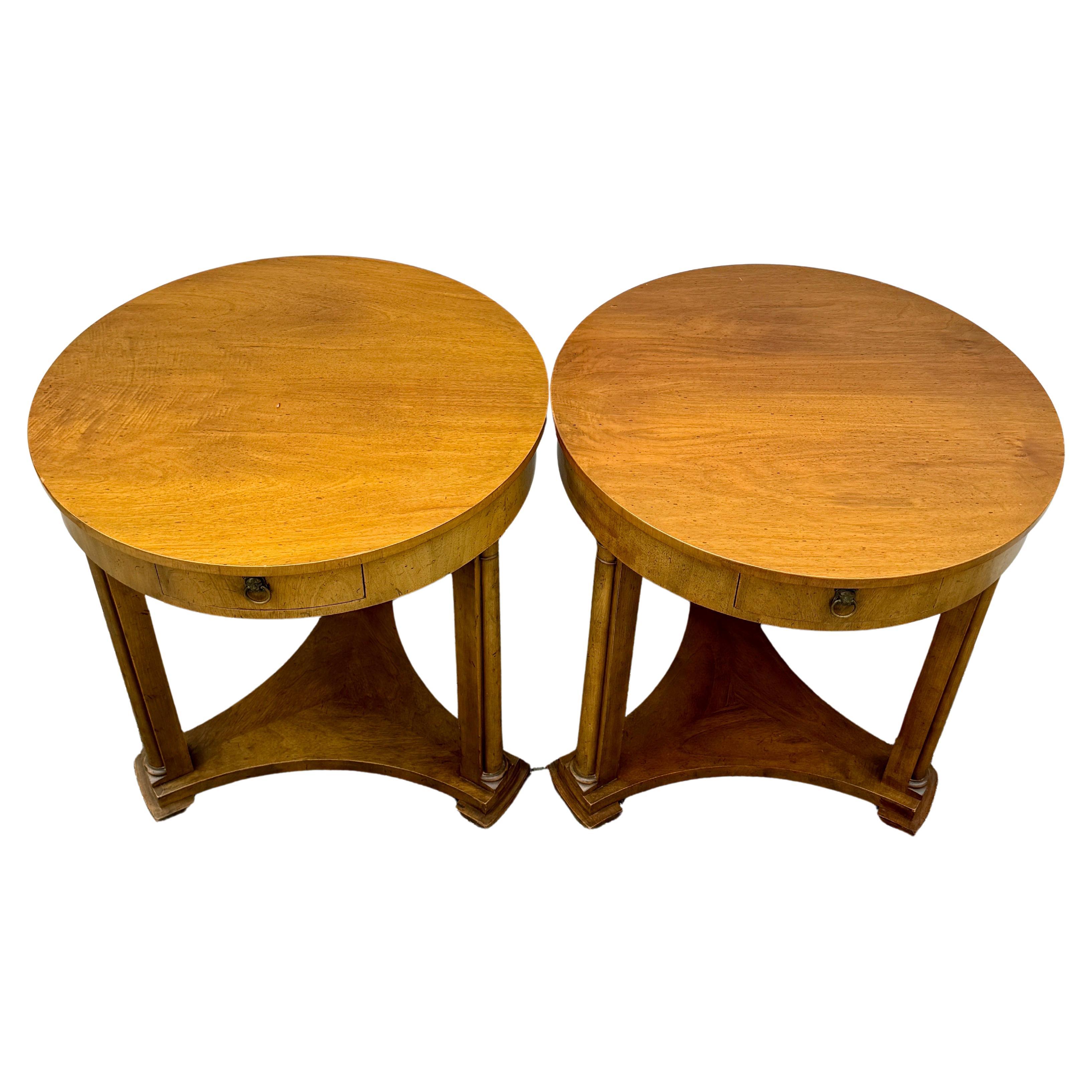 Baker Furniture Round End Side Center Hall Tables, A Pair

Vintage classic pair of wood tables from Baker Furniture that are very versatile for today’s interiors. These tables each have one drawer, with lion drawer pulls as well as three column