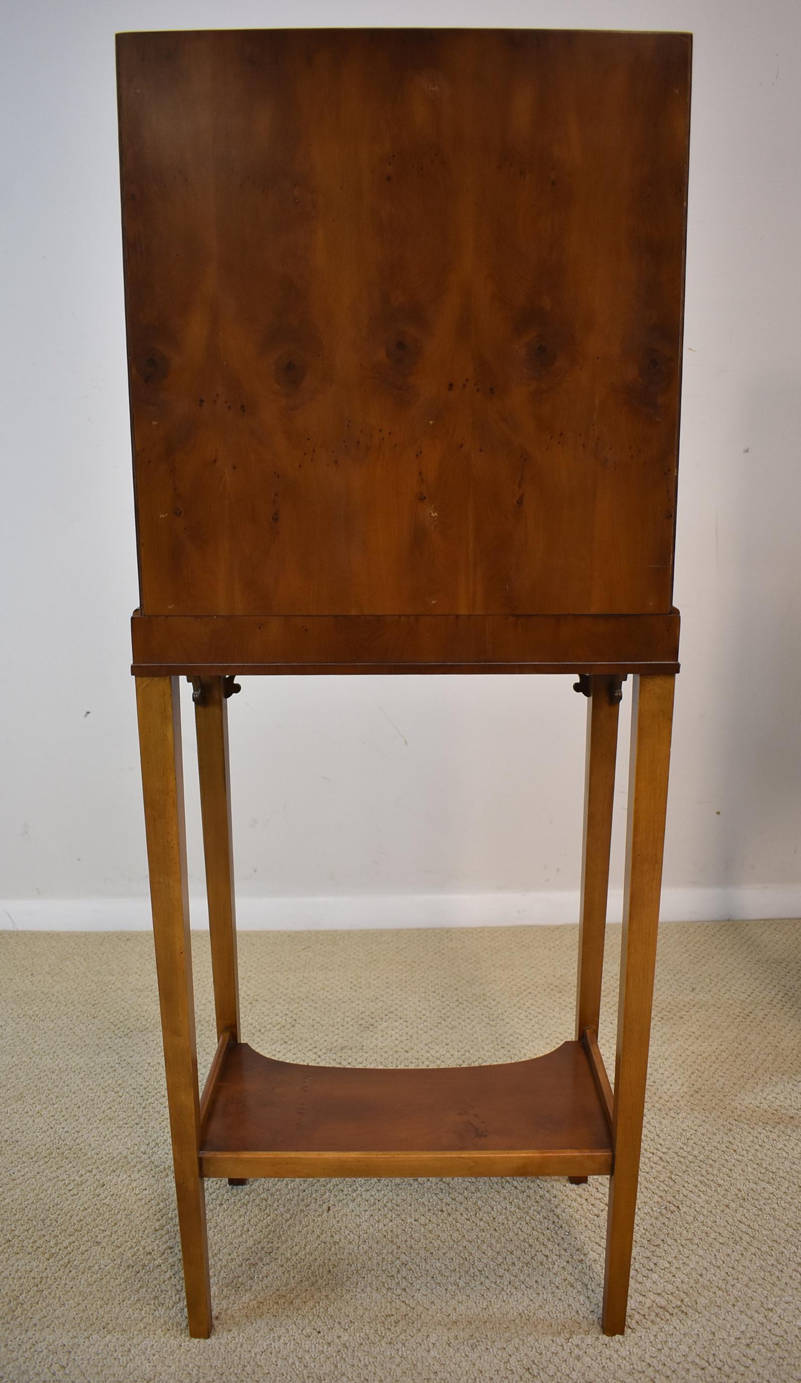 These yew wood and figured mahogany Baker stands are in excellent condition. Each stand has 3 drawers of oak construction and dovetailing. The brass hardware is original, and the Baker Furniture labels are present. 1 stand is slightly lighter than