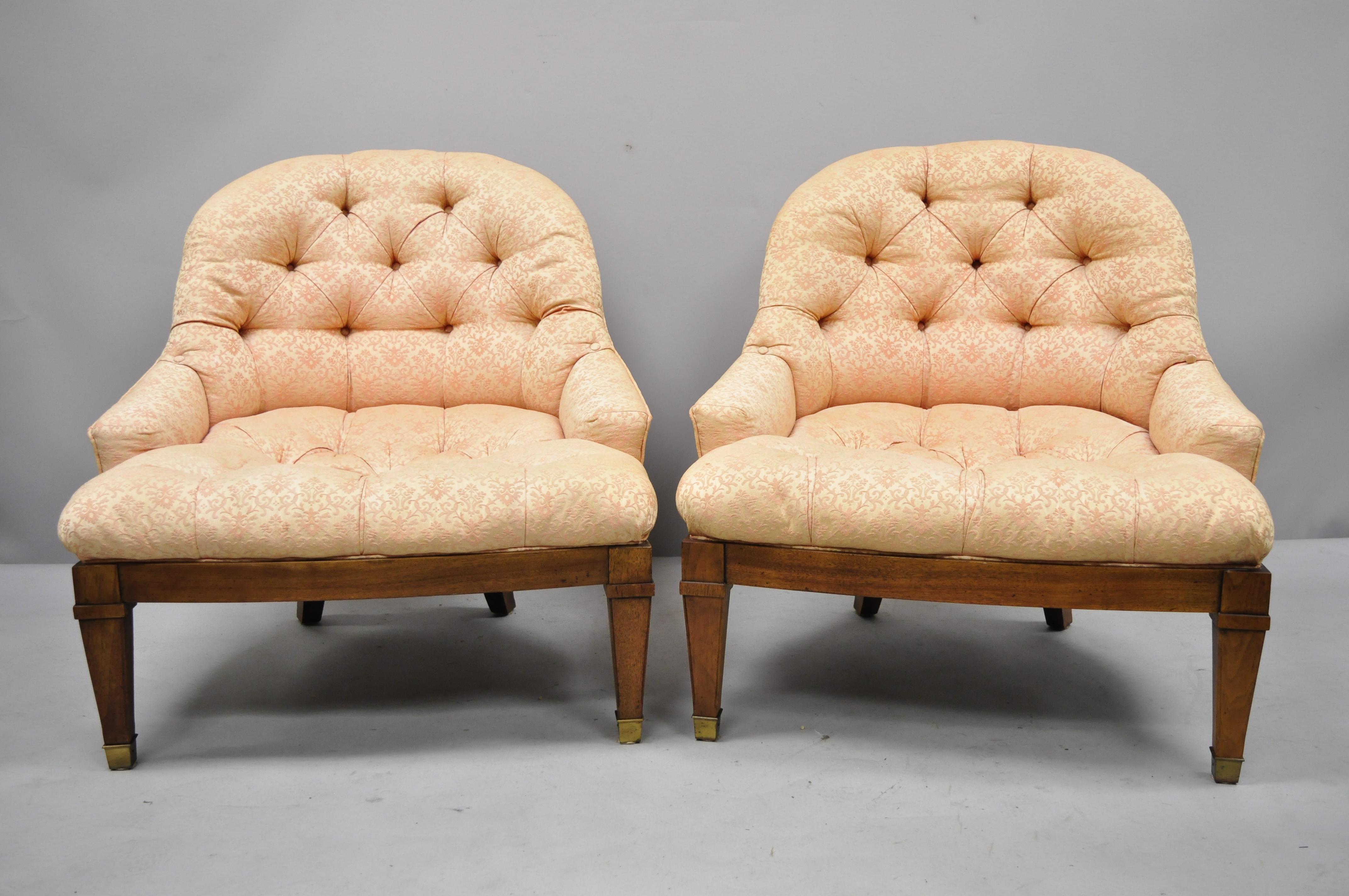Pair of Baker Tufted Barrel Back Slipper Salon Lounge Chairs Brass Feet. Items feature brass capped feet, low and wide form, tufted fabric, solid wood frame, tapered legs, quality American craftsmanship, great style and form. Circa mid 20th Century.