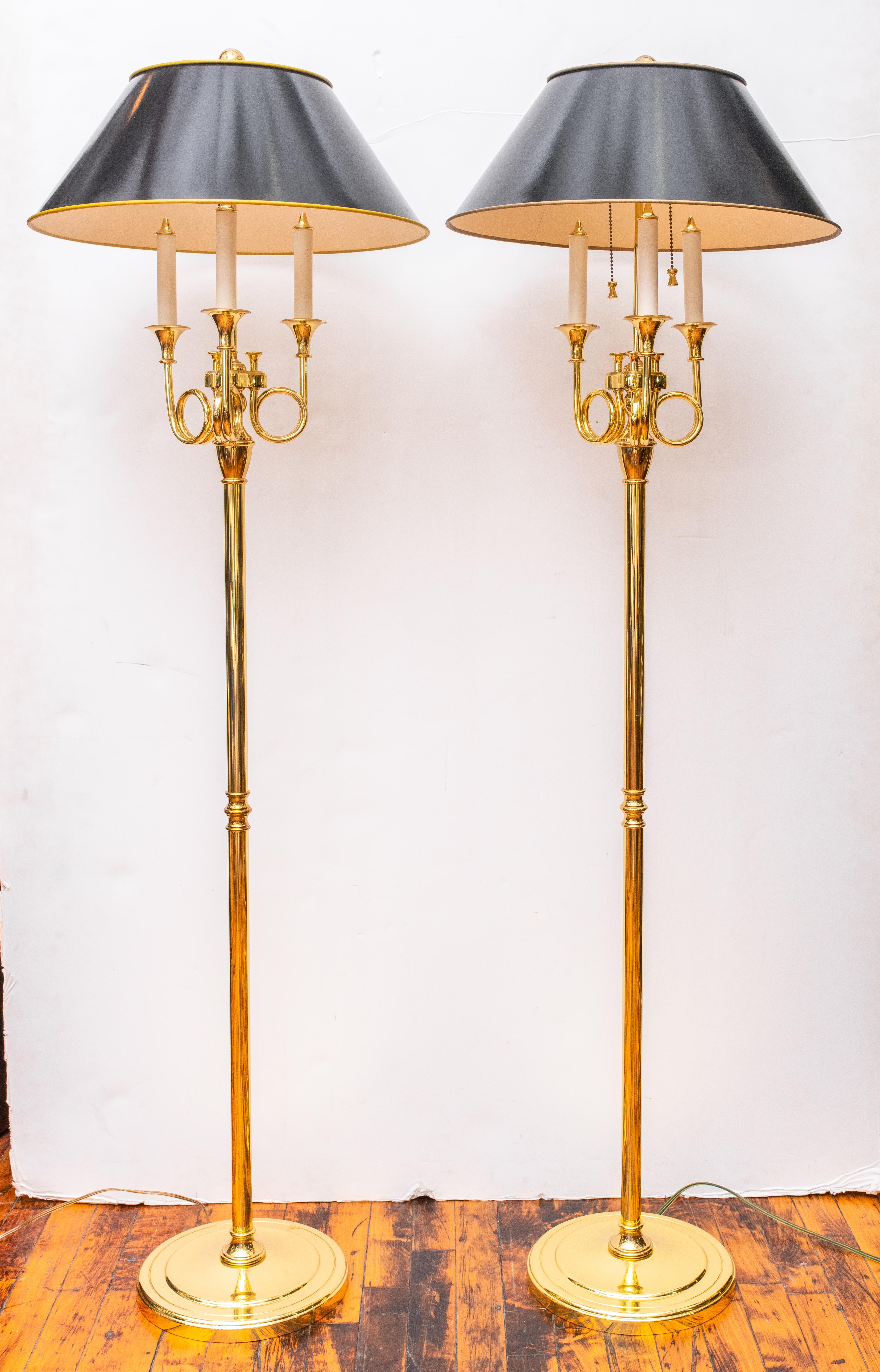 Pair of Baldwin heavy brass floor lamps with black shades. Made in the USA in the 1980s. Very good condition; wear consistent with with age and use. Signed.