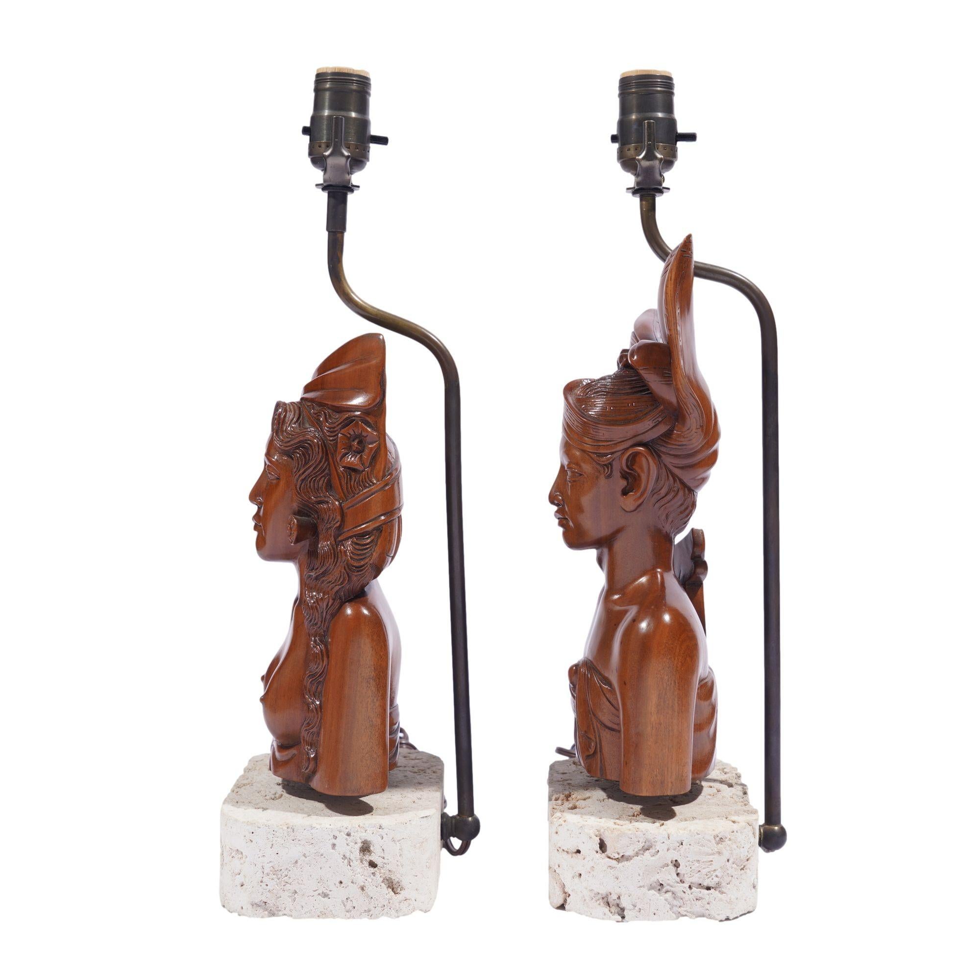 Indonesian Pair of Balinese carved bust lamps mounted on cut coral bases, c. 1920-40 For Sale